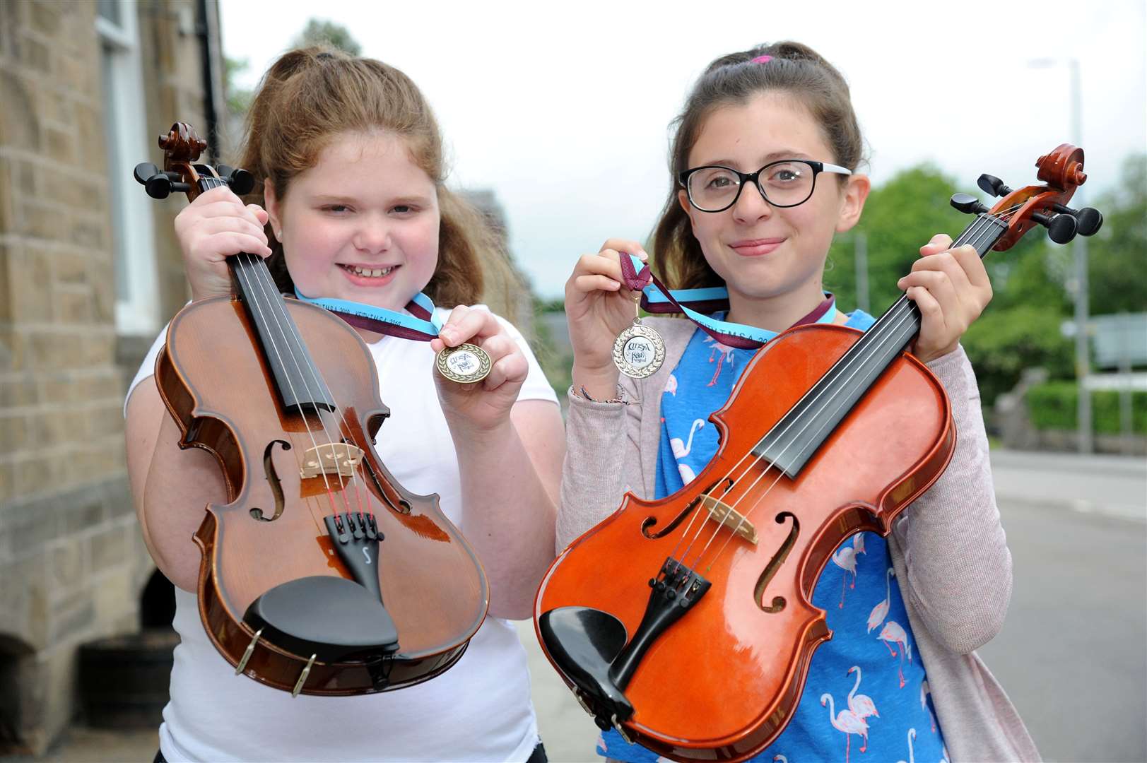 Kathryn Brown (left), from Glass, picked up a bronze and Kitty Sykes, Huntly won silver in the under 12 fiddle section.