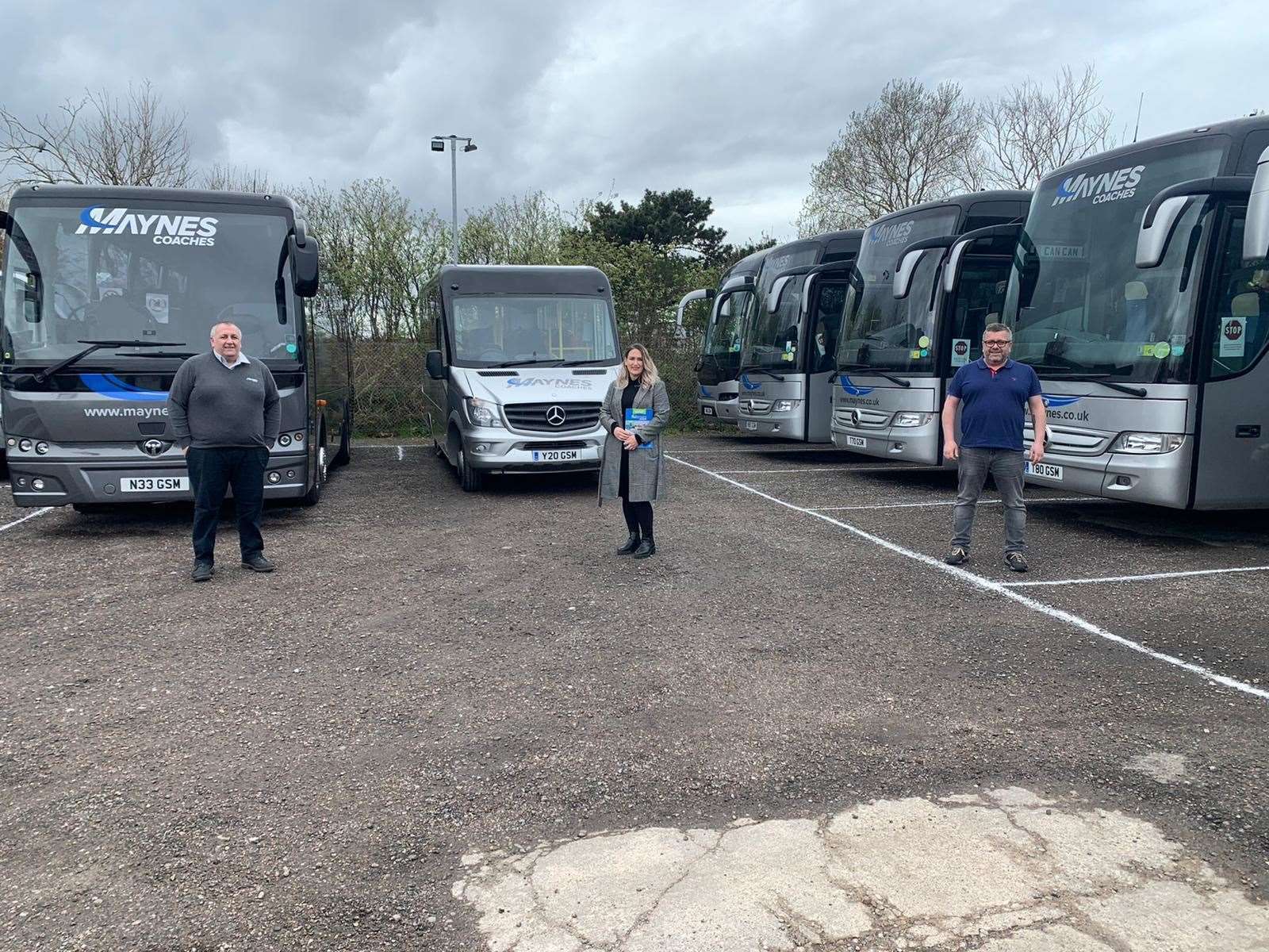 Karen Adam has a socially-distanced chat with Mayne's Coaches directors Kevin (left) and David Mayne during her visit to the firm's March Road depot. Picture: SNP