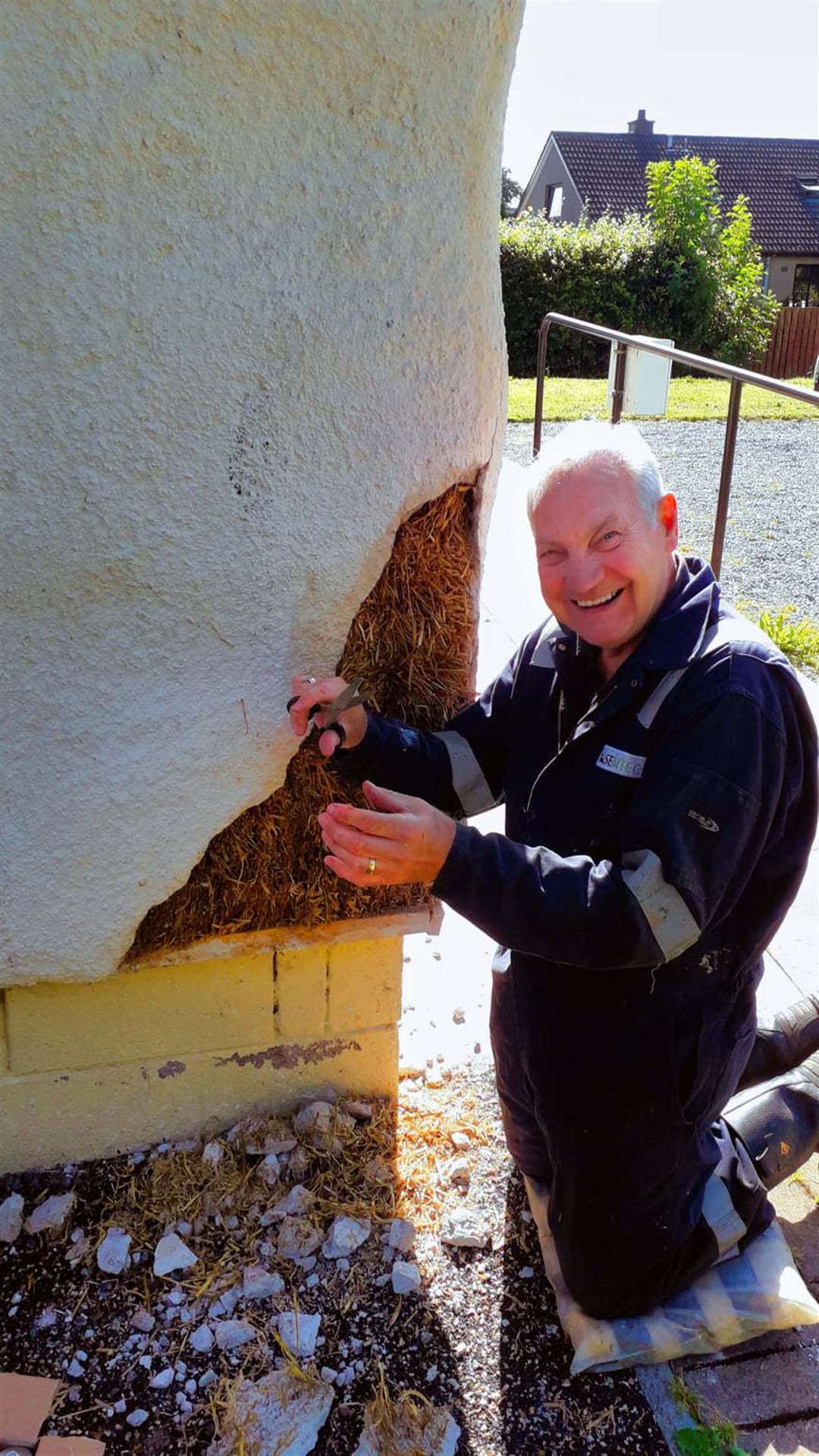 Brian Johnstone, Chairman of Action Kintore helping to repair the damage
