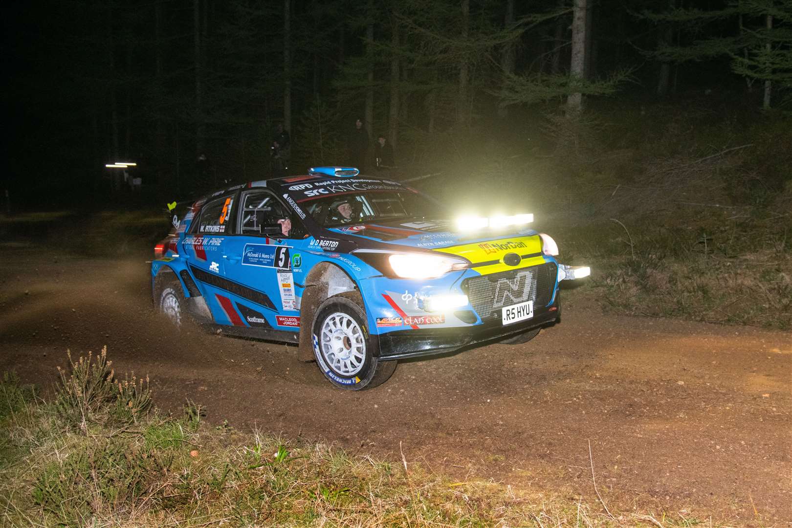 John Wink drives through the dark forests during Friday night action at the Speyside Stages. Picture: Daniel Forsyth