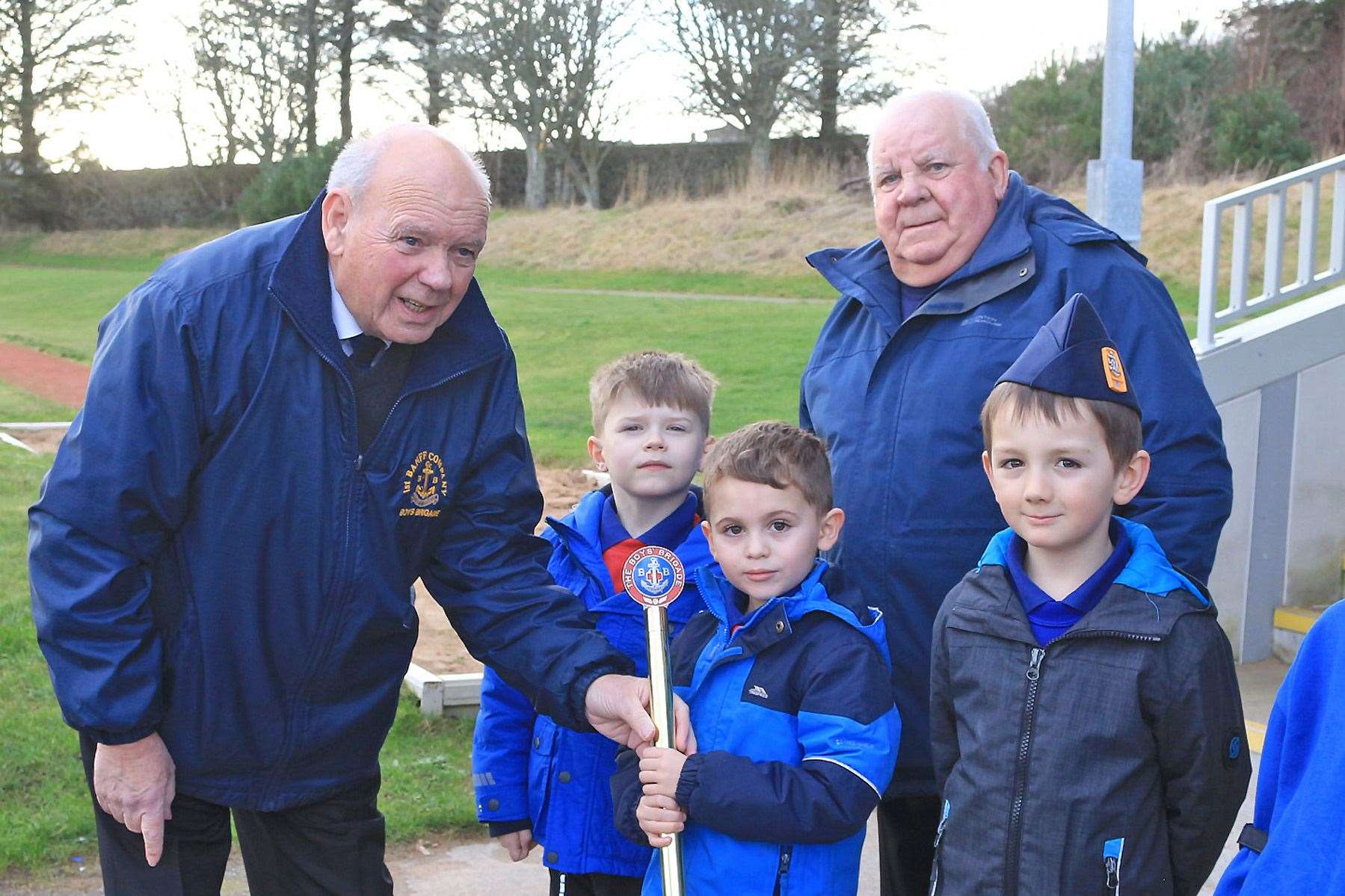 Captain Ian Cameron (left) and other Boys' Brigade members with the baton. Picture: Andrew Taylor