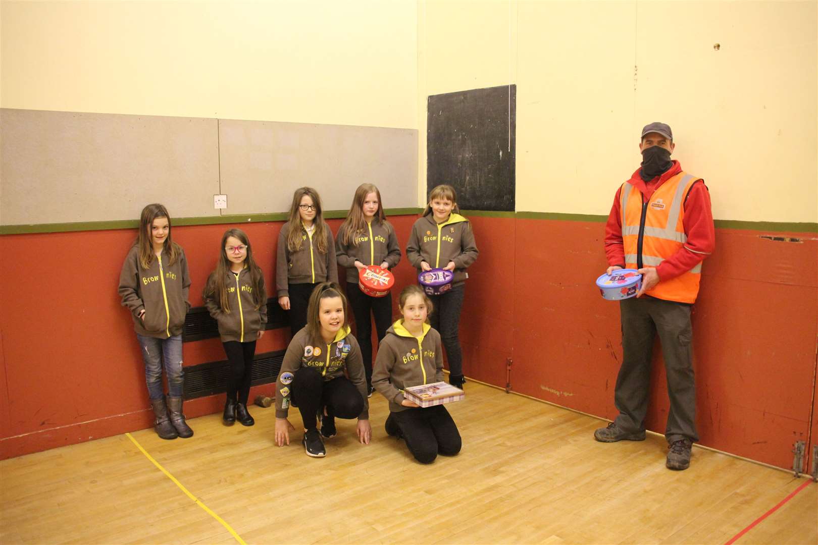 1st Turriff Brownies welcomed local postman Micheal Gray as part of a project they've worked on this year. Picture: Kirsty Brown