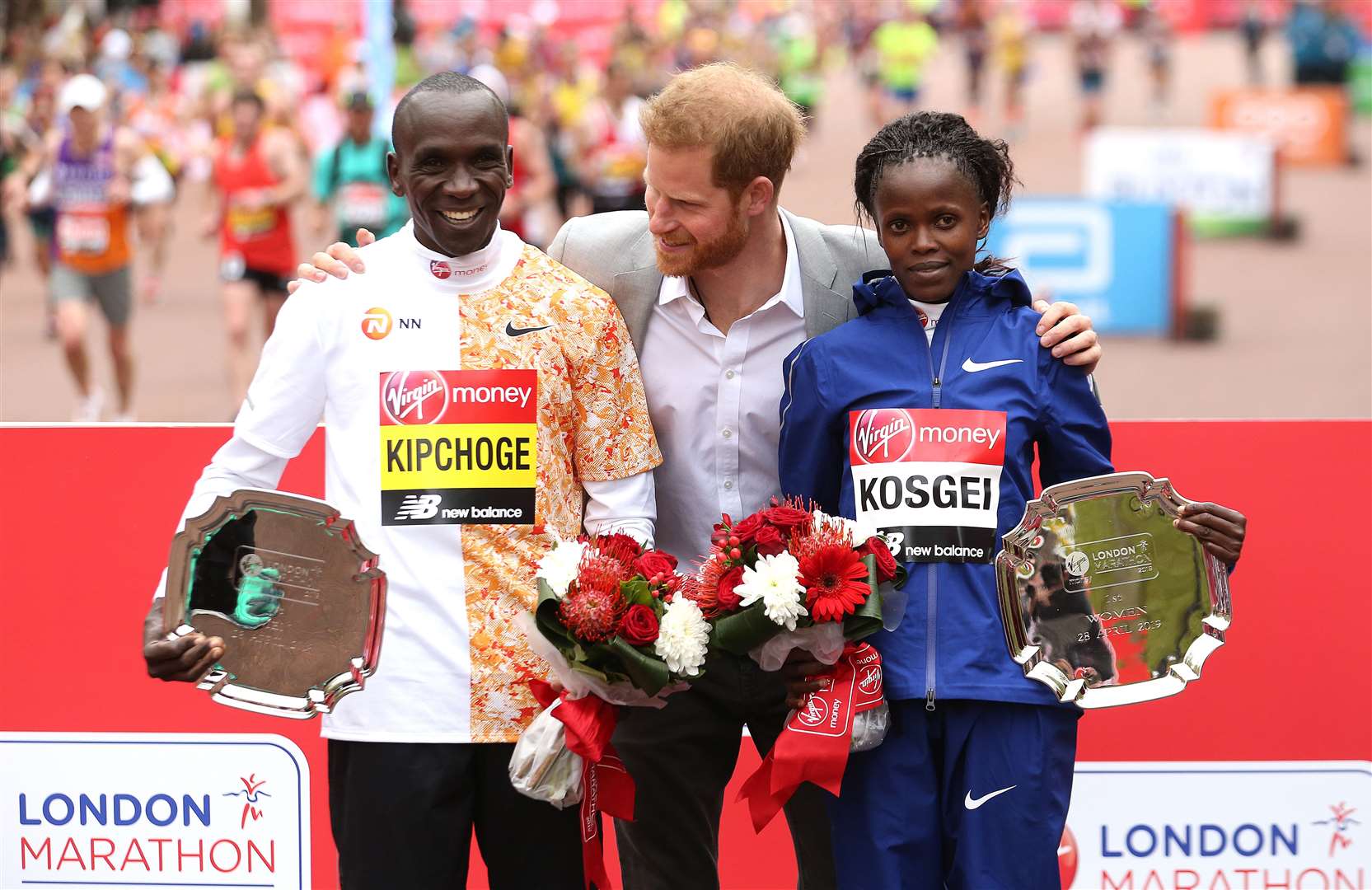 The Duke of Sussex poses with the winner of the men’s marathon Kenya’s Eliud Kipchoge and women’s marathon Kenya’s Brigid Kosgei after last year’s event (Paul Harding/PA)