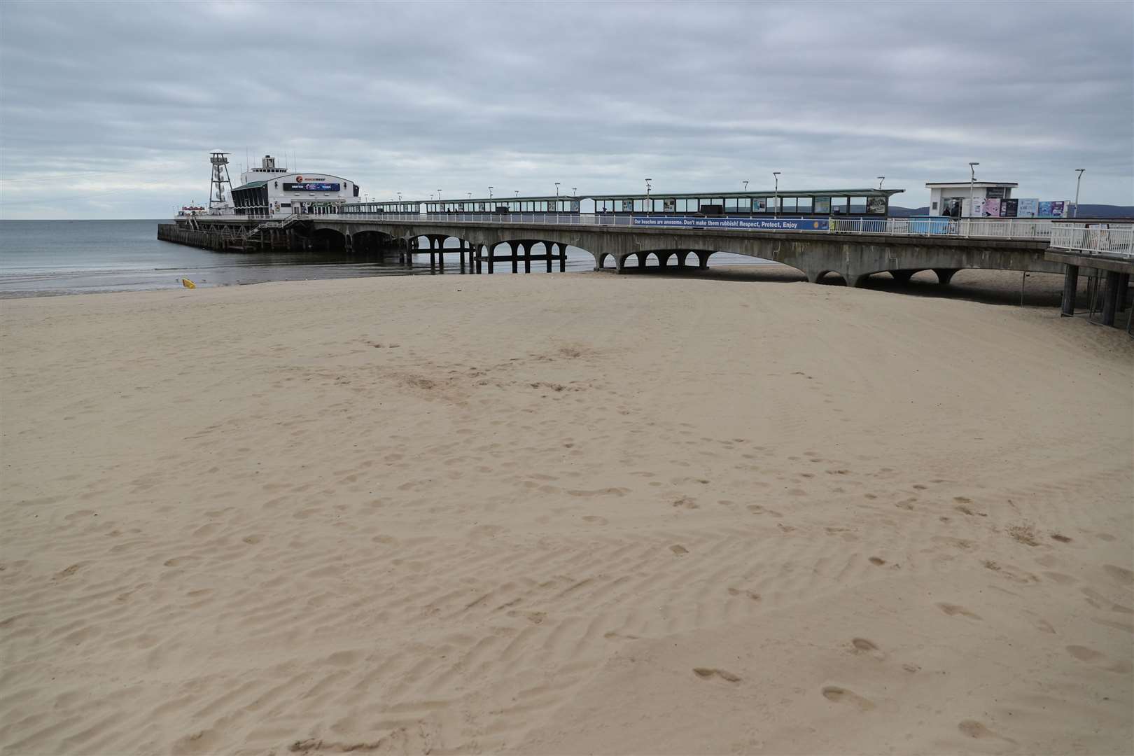 An empty beach and pier at Bournemouth (Andrew Matthews/PA)