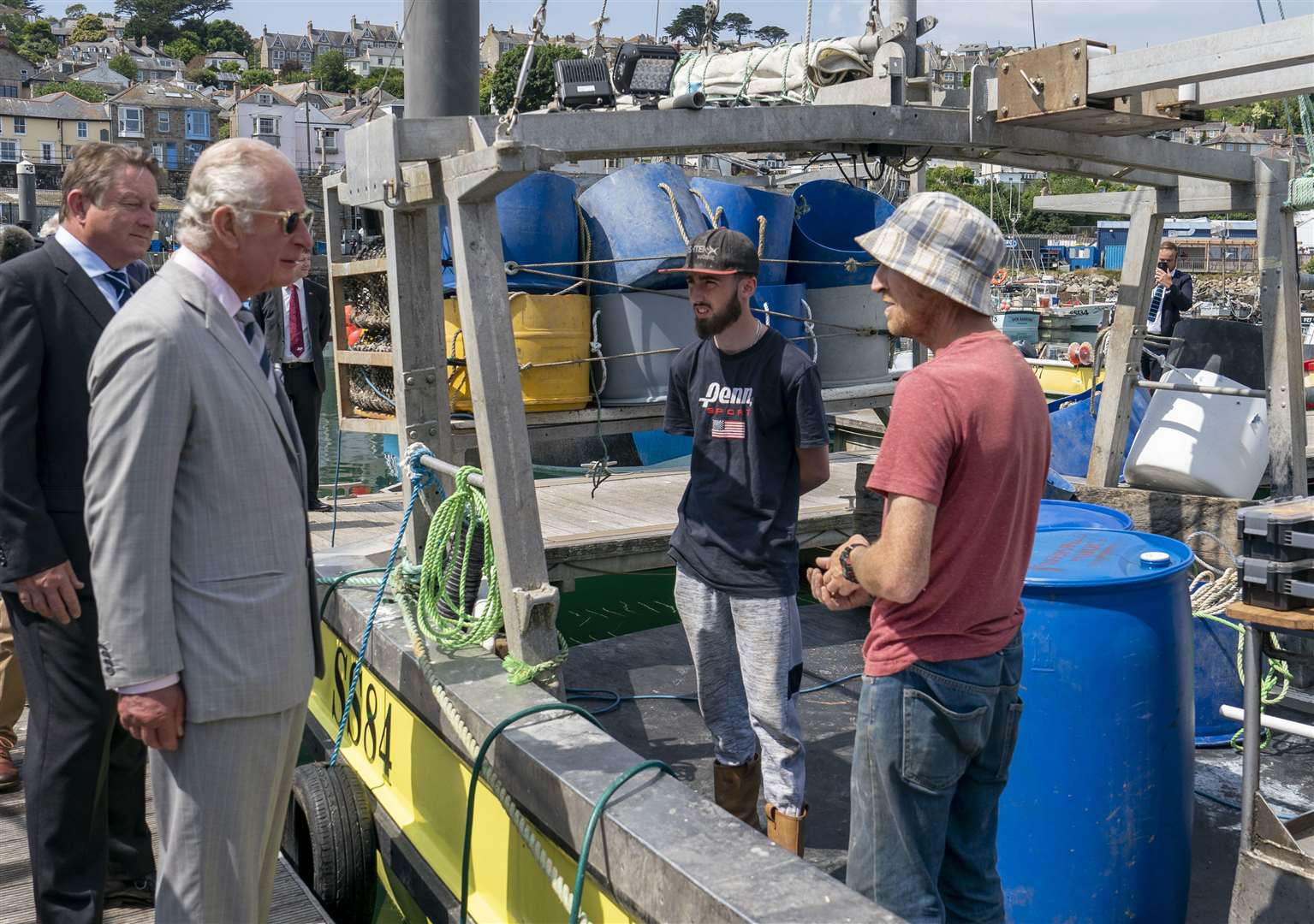 The Prince of Wales talks to local fishermen (Arthur Edwards/The Sun/PA)