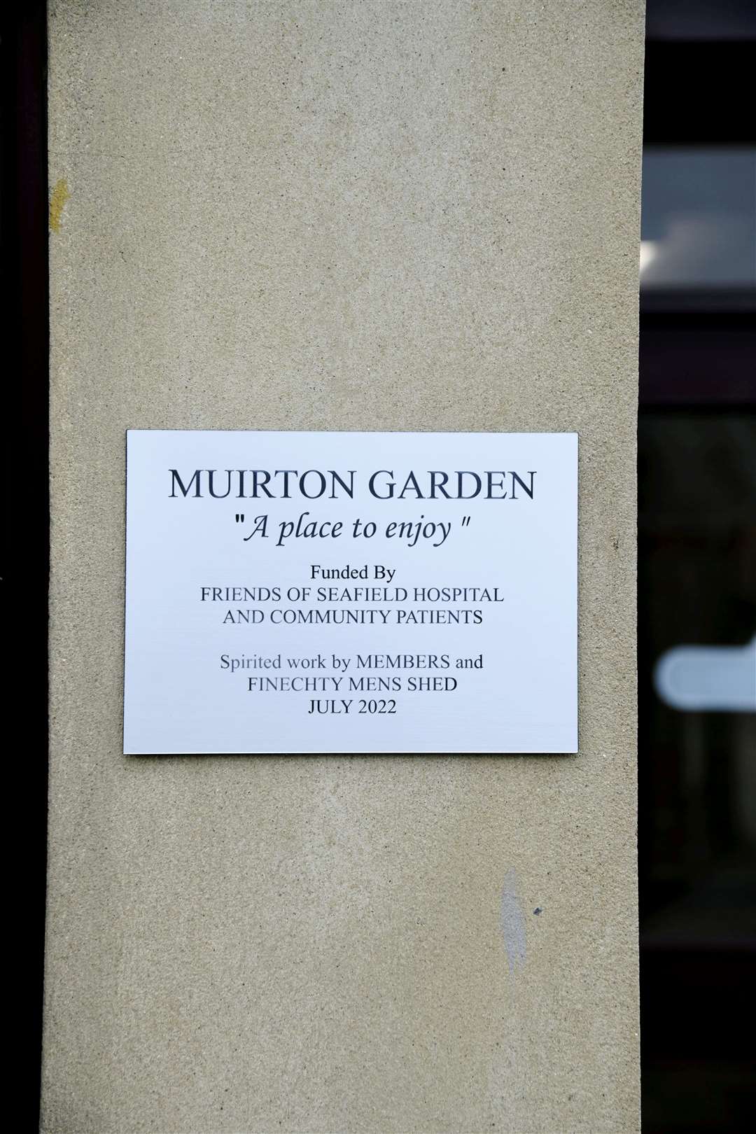 The plaque on the side of the building to commemorate the new garden. Picture: Beth Taylor