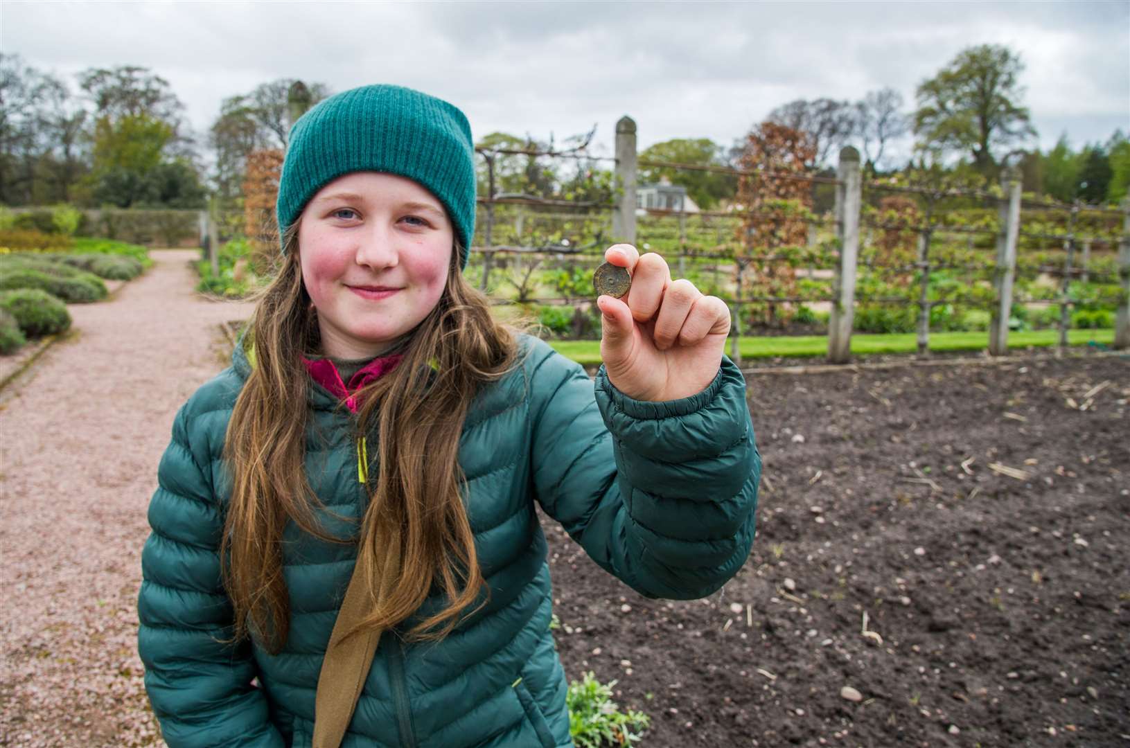 Tilly Roberts with the rare Wellington button she found while volunteering at Gordon Castle Walled Garden. Picture: Becky Saunderson.