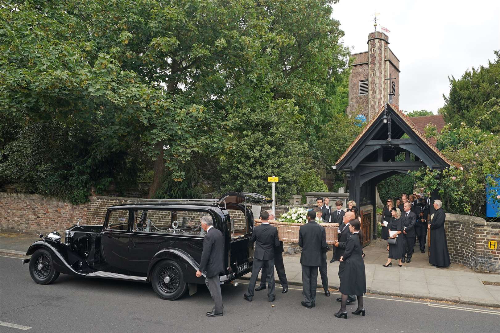 The coffin is carried out following the funeral service at St Mary’s Church in Barnes (Dominic Lipinski/PA)