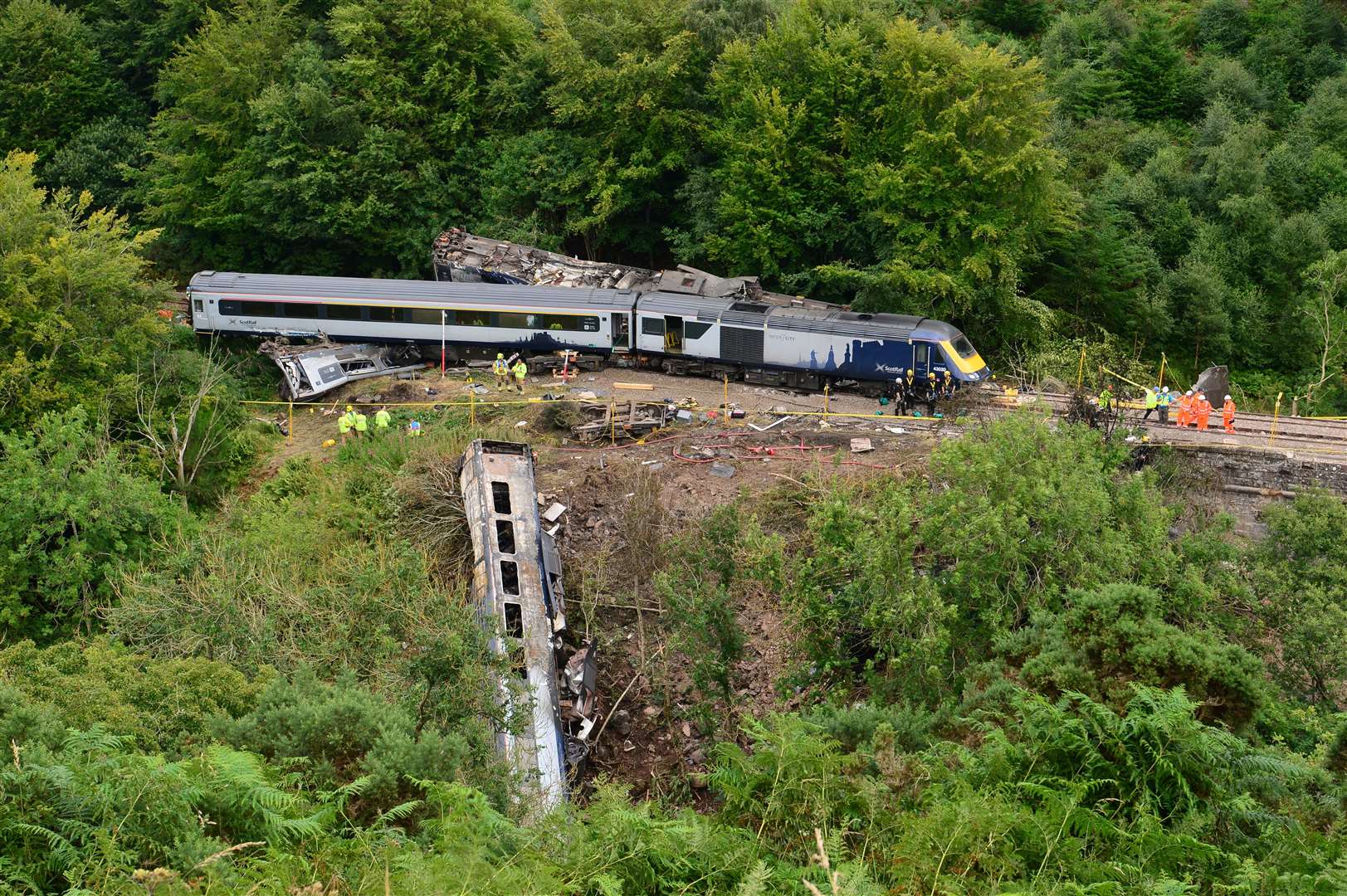 Part of the train plunged down an embankment in the crash (PA)