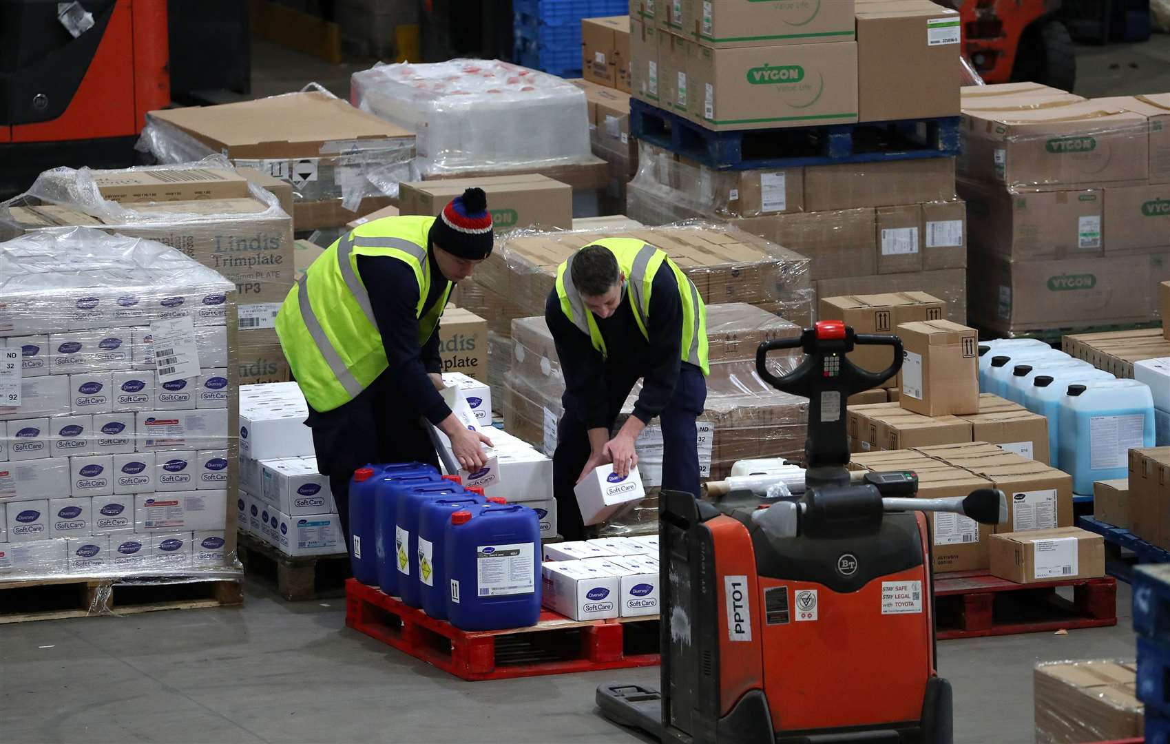 Workers load boxes with supplies at a storage facility in Scotland as part of Brexit preparations (Andrew Milligan/PA)