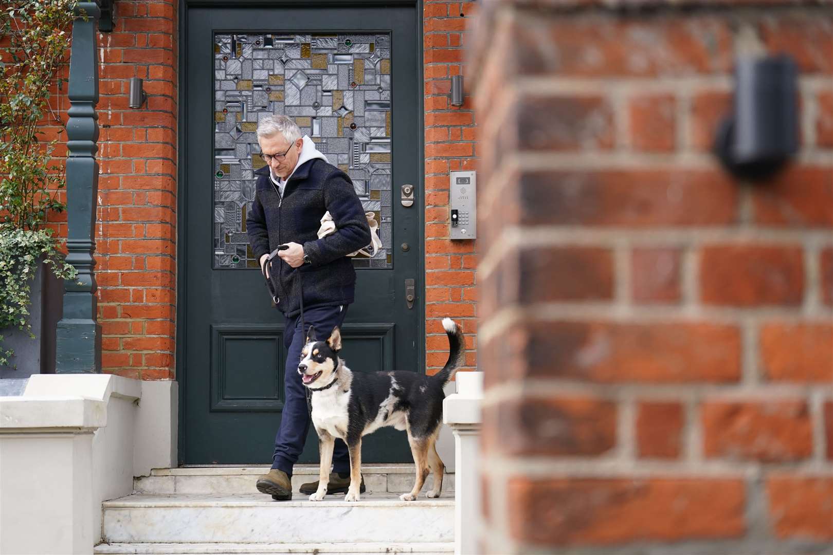 Gary Lineker leaves his home in London with his dog (James Manning/PA)