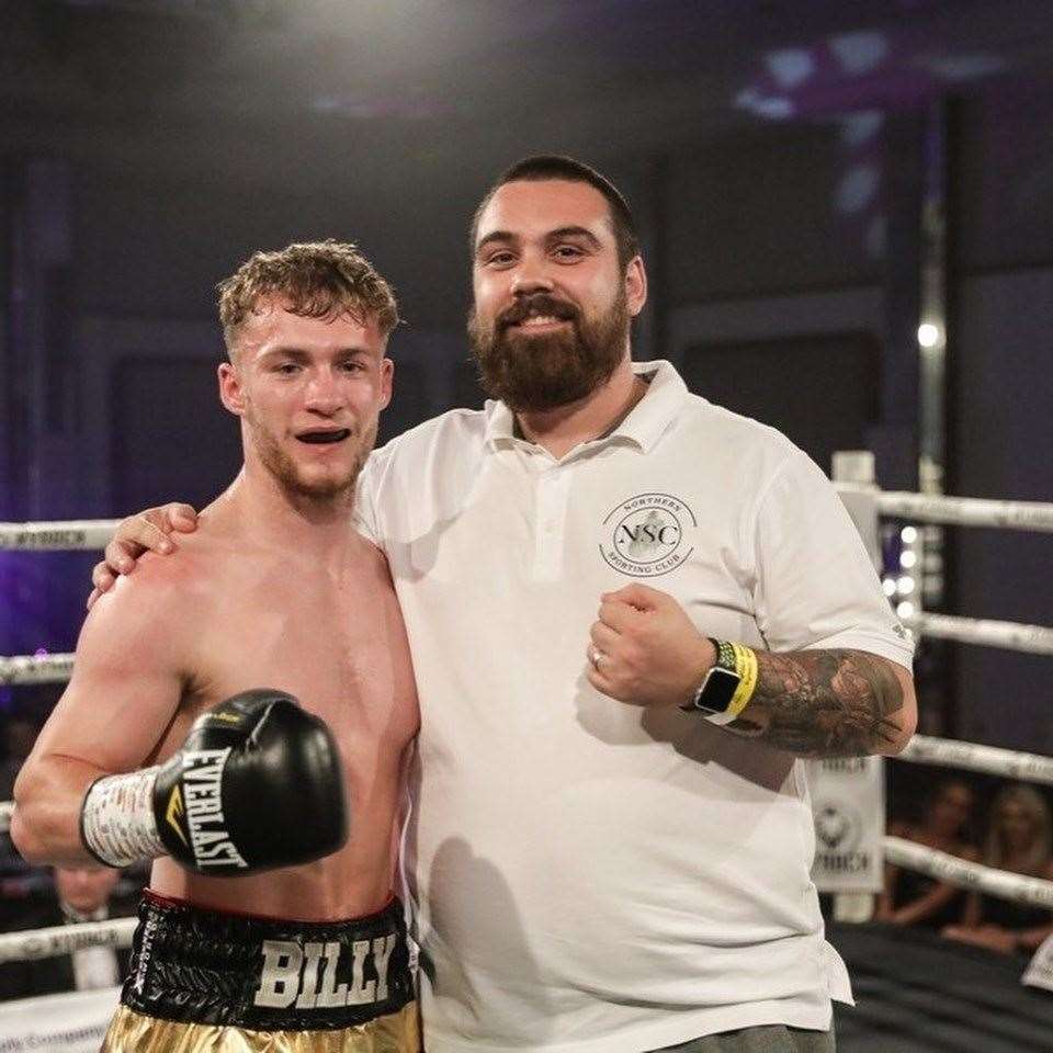 Billy Stuart with his manager David McAllister after his return to the ring.