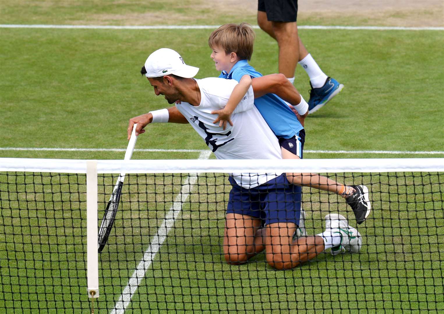 Novak Djokovic and his son during his practice session on day eight of the 2022 Wimbledon Championships (John Walton/PA)