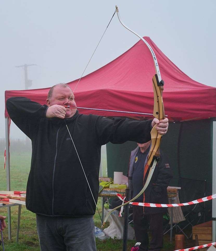 World darts champion, John Henderson takes an aim of a different kind. Picture: David Simpson.