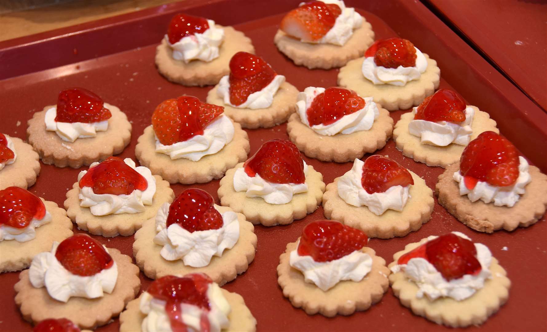 Some delicious looking strawberry tarts.