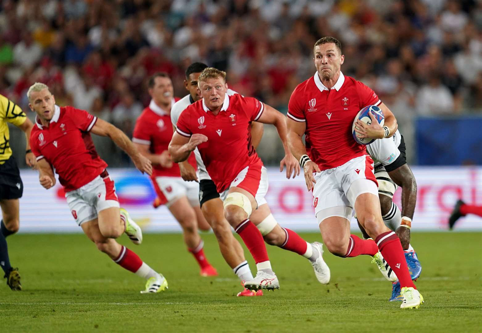 Wales break away during the Rugby World Cup match against Fiji (David Davies/PA)