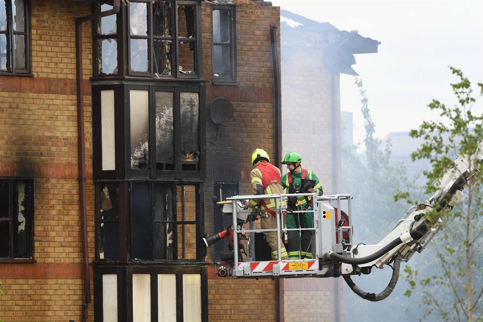 Firefighters at the scene of the blast (Doug Peters/PA)
