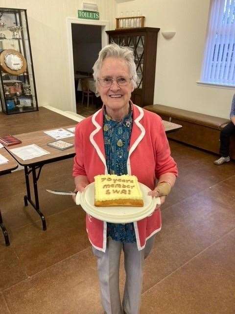 Piece of cake...Jessie Low celebrates 70 years as an SWI member. Picture: Arradoul SWI