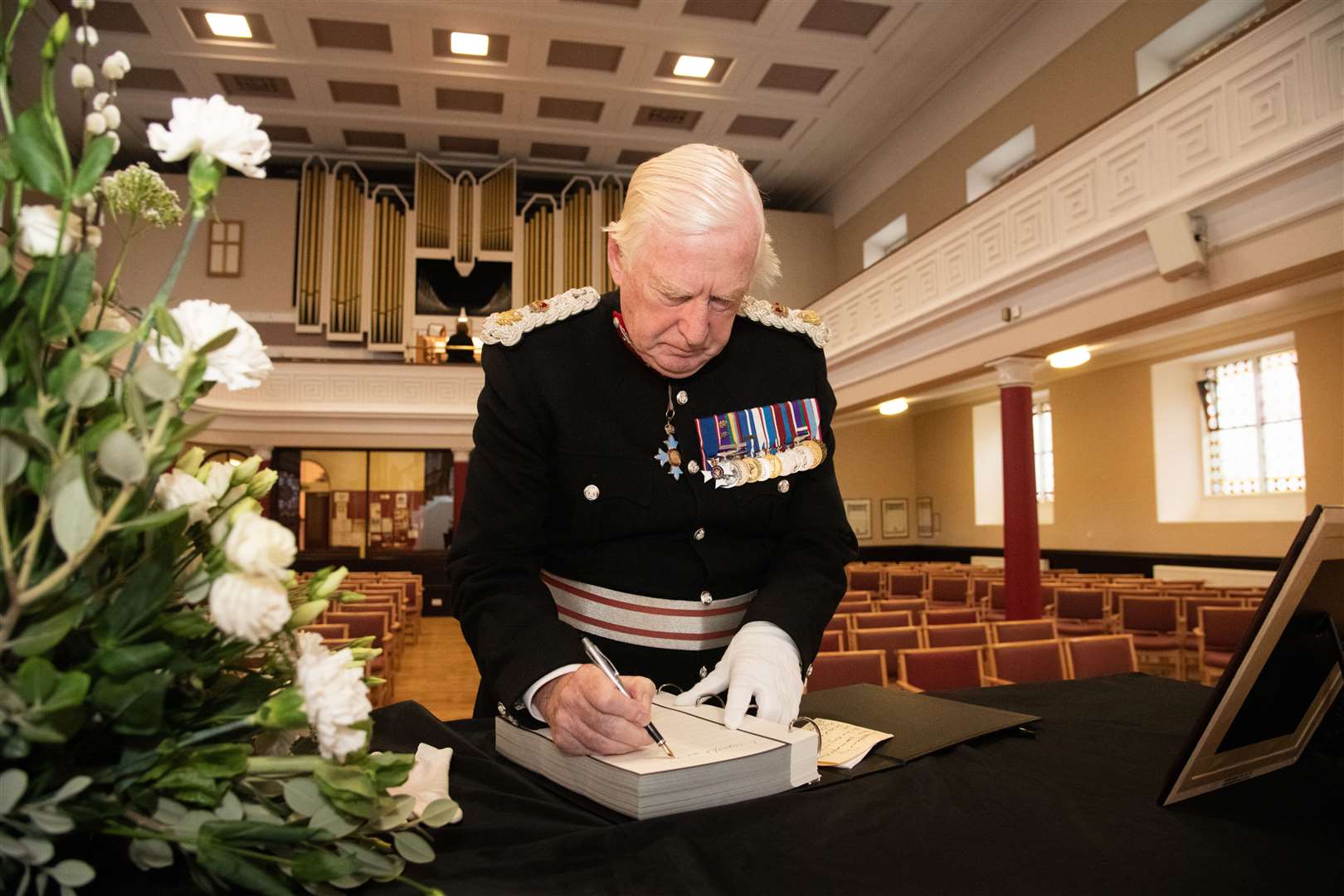 The Lord Lieutenant of Moray Major General Seymour Monro writes in the book of condolence in memory of Queen Elizabeth II.Picture: Daniel Forsyth