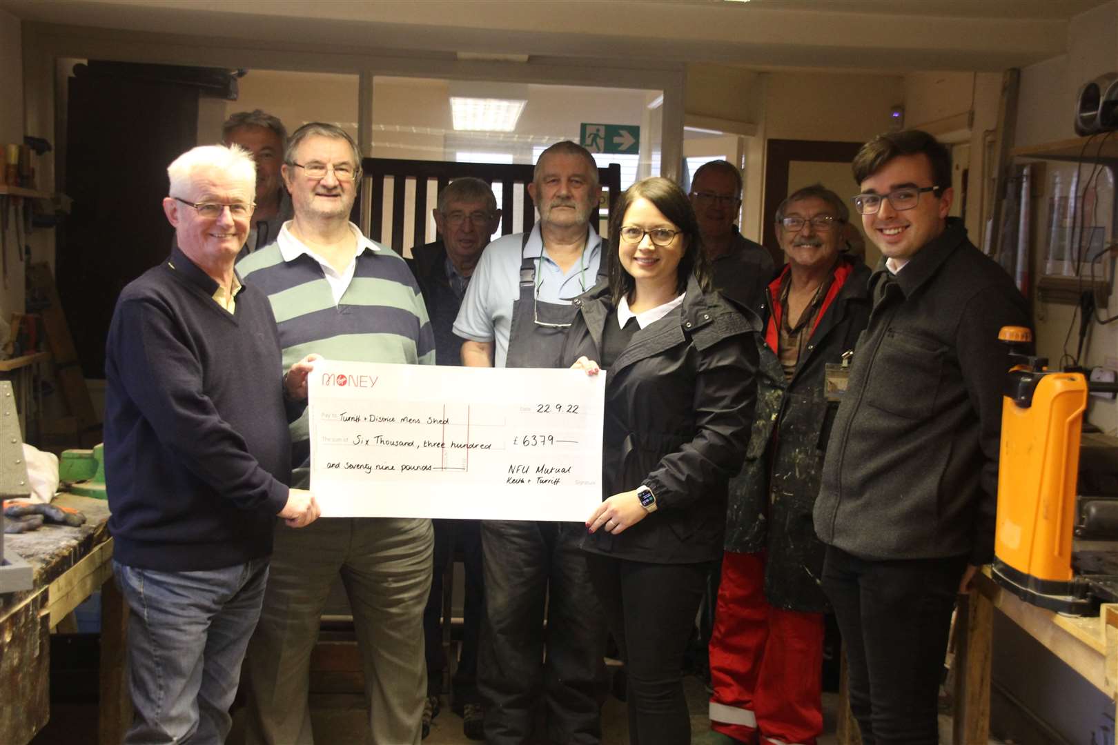 NFU's Sarah Law presented the cheque to Turriff and District Men's Shed chairman Ian Murray. Picture: Kirsty Brown