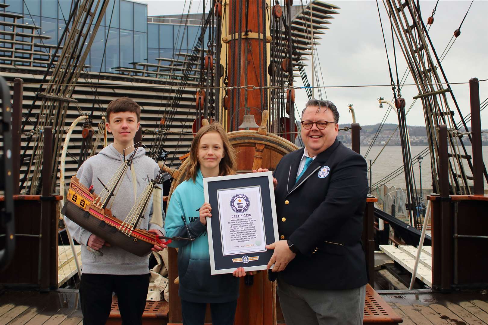 Guinness World Record holders Ollie and Harry Fergusson from Turriff were presented with their certificate aboard the Discovery in Dundee by Craig Glenday, Editor-in Chief, Guinness World Records. Picture: Dundee Heritage.