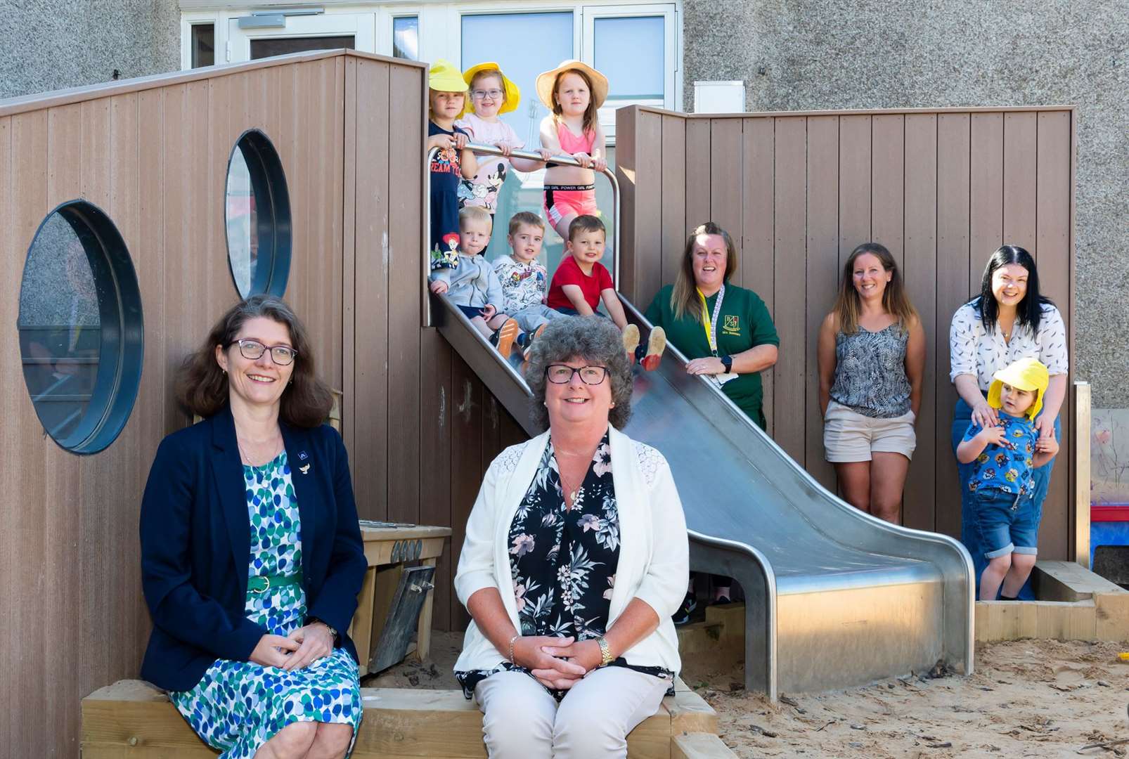 Councillor Rosemary Bruce (left) councillor Gillian Owen, Lisa Summers (Early Years Practitioner) and a selection of children, childminder Zoe Sadler and mum Rhona Hopkins at Buchanhaven Nursery, one of the settings in Aberdeenshire where the additional 1140 early learning and childcare hours are available.
