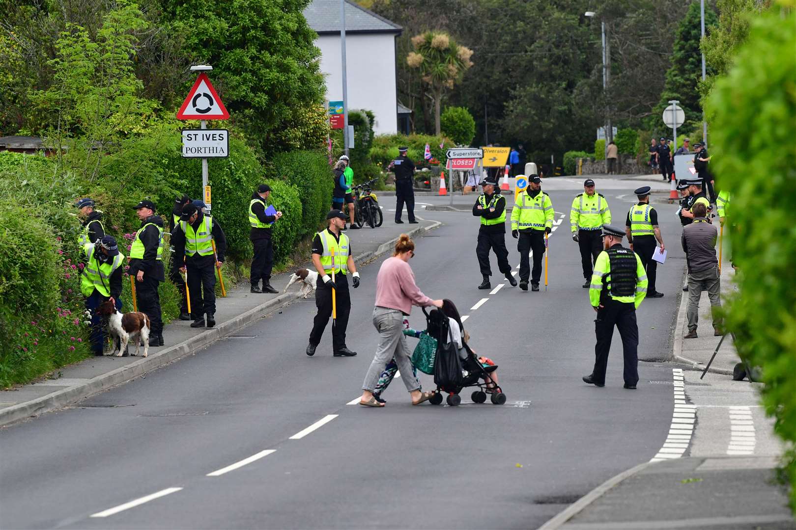 Police activity on the route of a US motorcade in Carbis Bay (Ben Birchall/PA)