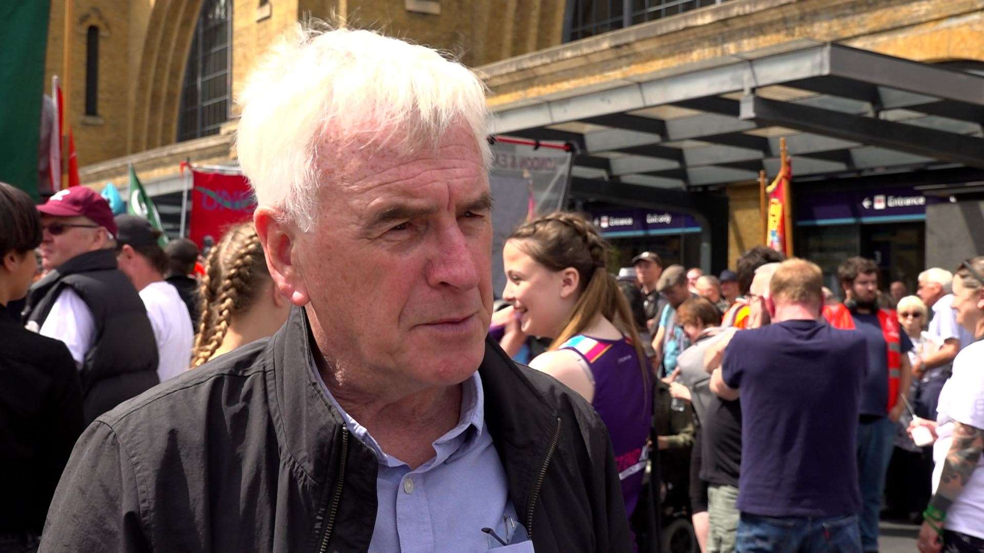 John McDonnell speaks to the media at a rally outside Kings Cross station (Sarah Collier/PA)