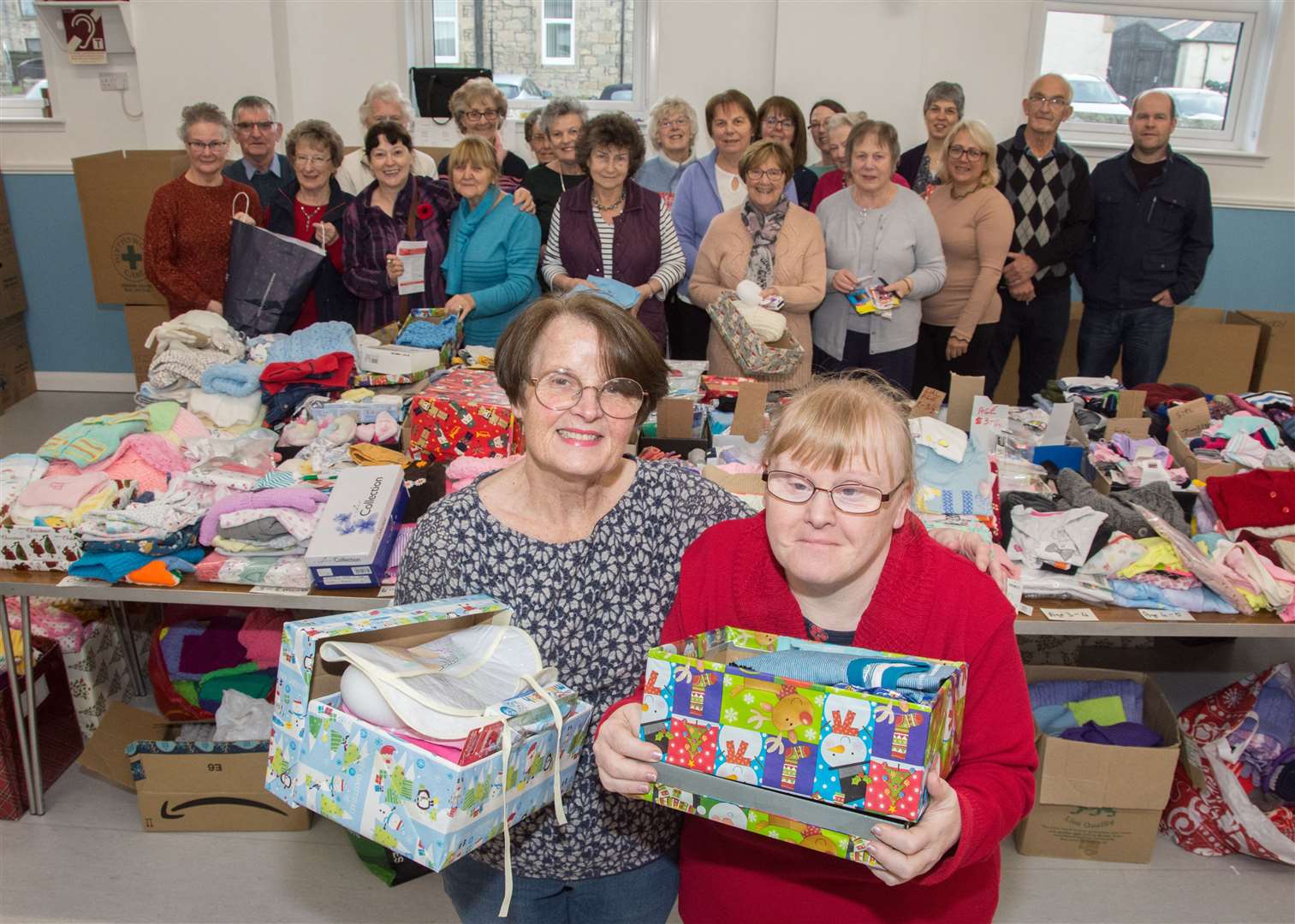 Getting cracking with the packing are Joan Thain (front left) and Lorna Cruickshank (front right) along with other Blysthwood volunteers. Picture: Becky Saunderson