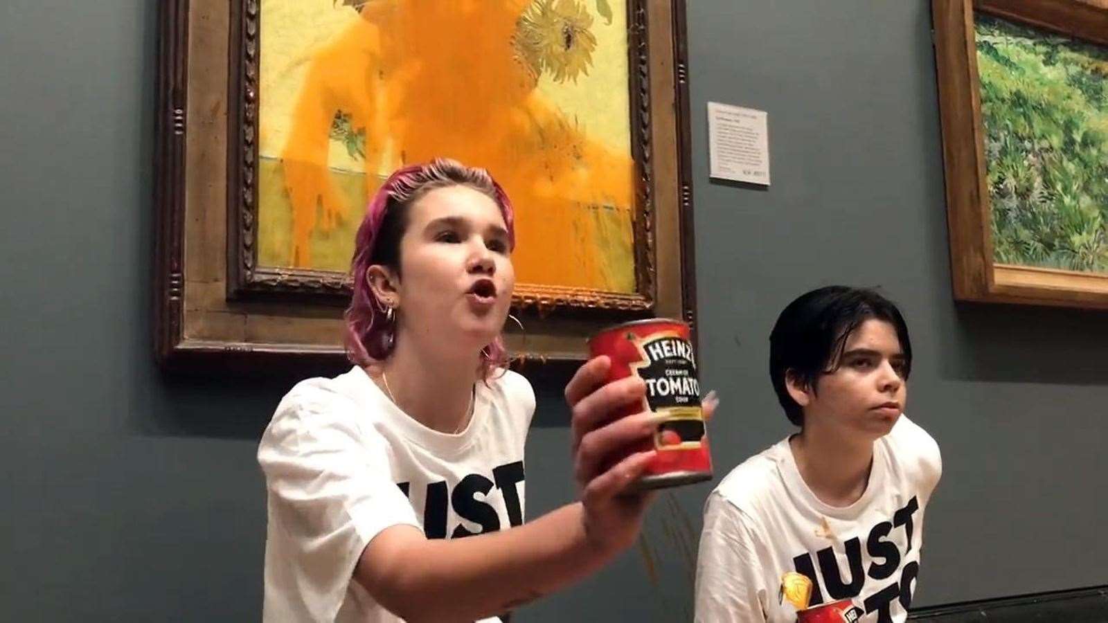 Two protesters threw tinned soup at Vincent Van Gogh’s 1888 work Sunflowers at the National Gallery in London (Just Stop Oil/PA)