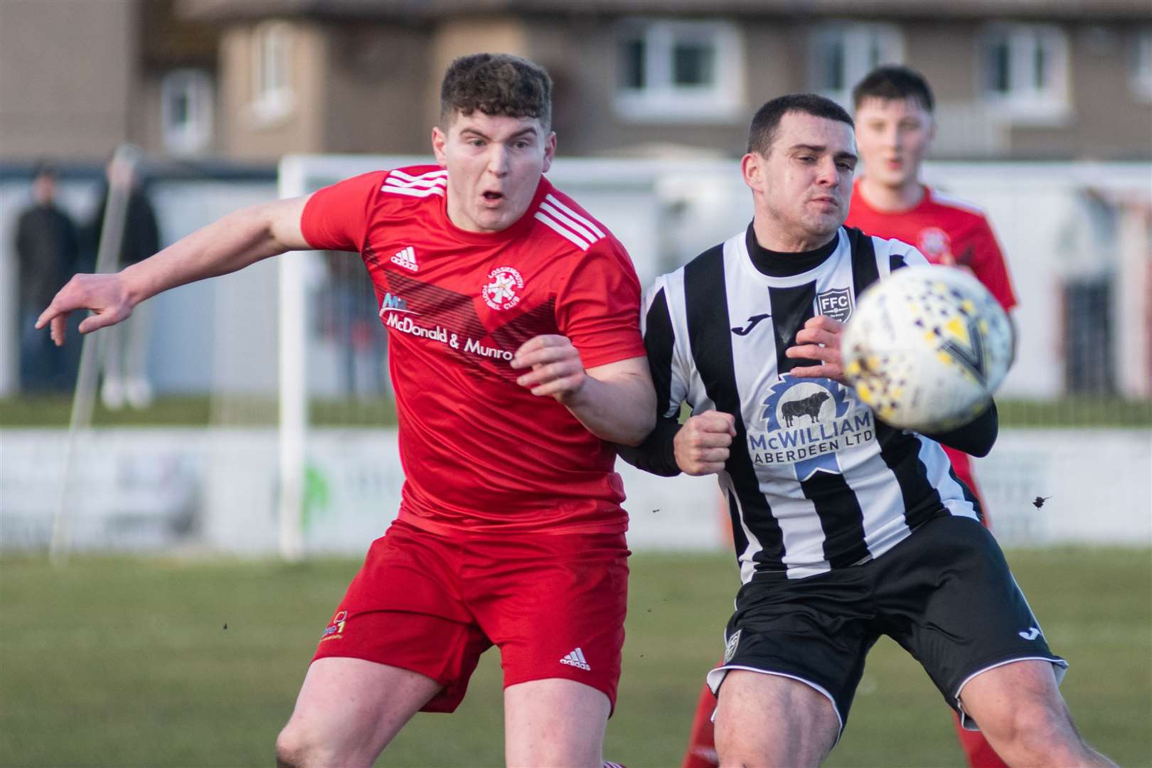 Fergus Edwards tries to repel the threat of Broch striker Scott Barbour. Picture: Daniel Forsyth