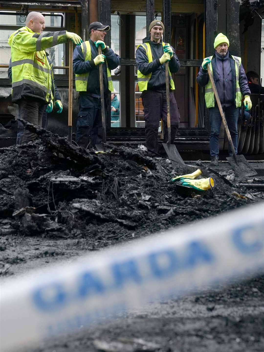 The clean-up in the aftermath of violent scenes in the city centre (Brian Lawless/PA)