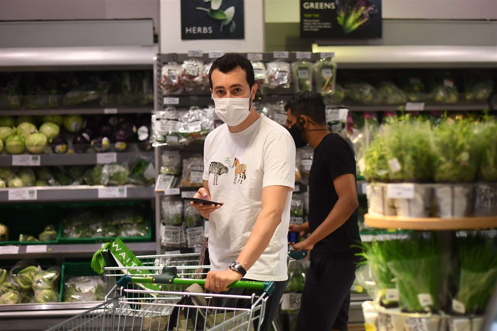 Face coverings are now mandatory, but it has not stopped shoppers flocking to stores in huge numbers (Victoria Jones/PA)