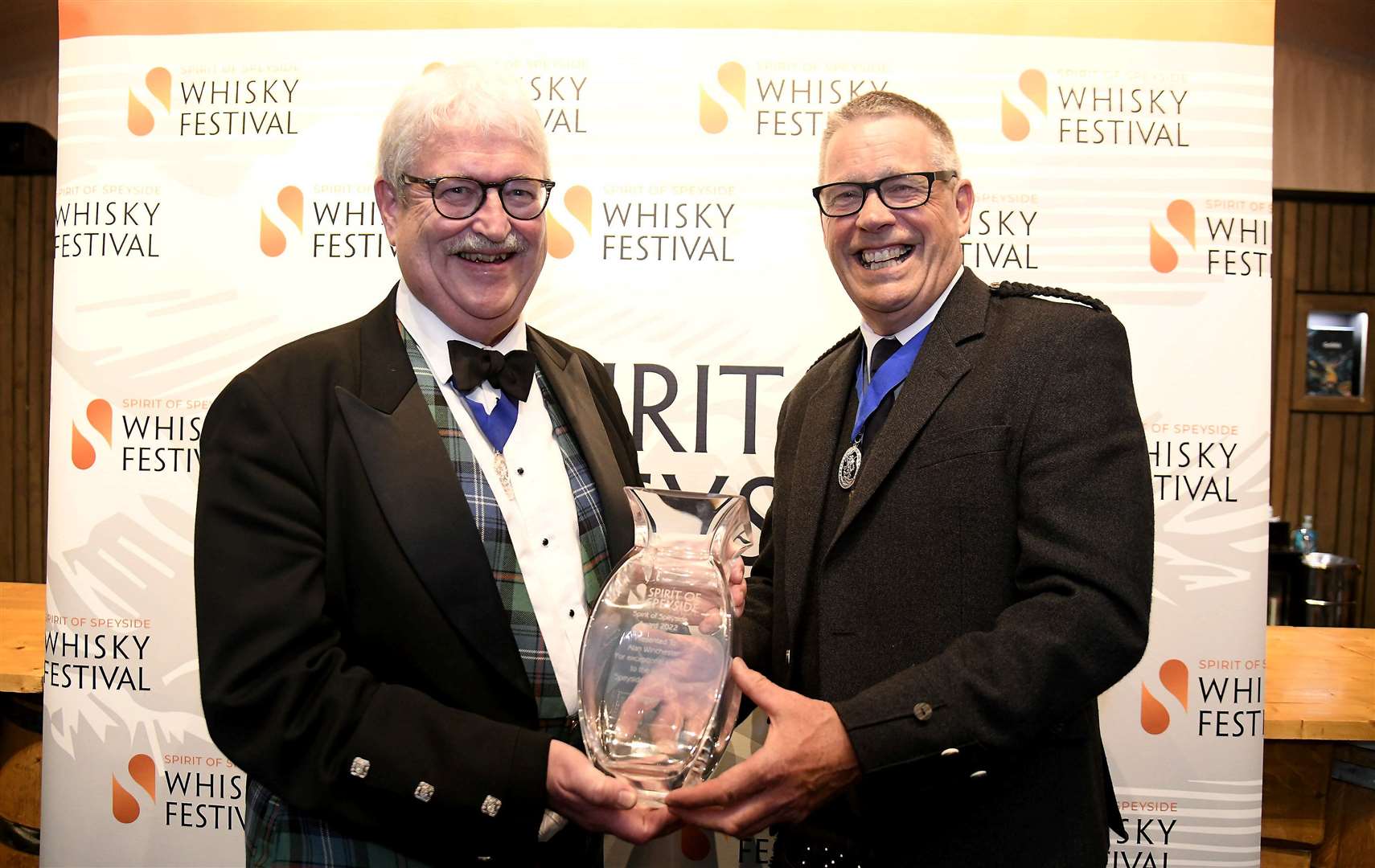 Allan Winchester (right) is presented with the Spirit of Speyside Award by Michael Urquhart. Picture: Becky Saunderson