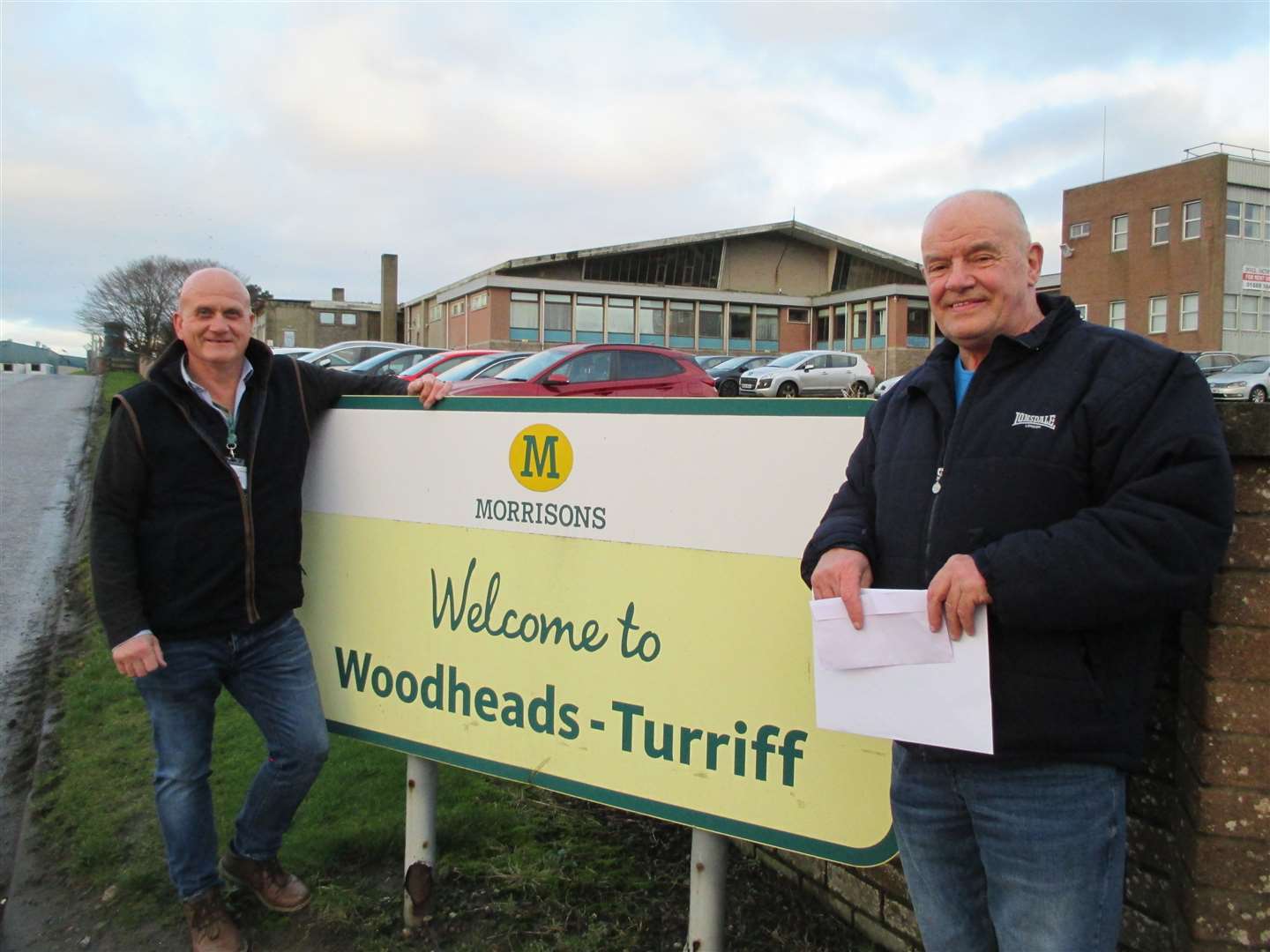 Eric Masson (right) has retired from working at the Morrisons site in Turriff with well-wishers including department manager Gordon Taylor.