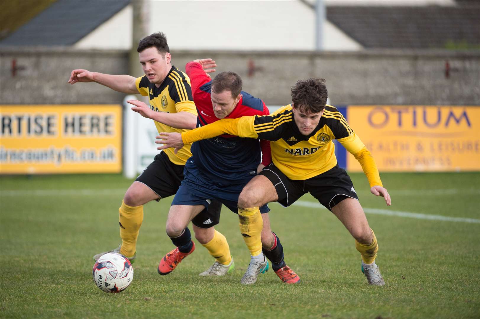 In action (centre) for Turriff United, Aaron McKenna gave Ben Allan advice on how to cope with college life in America. Picture: Callum Mackay.