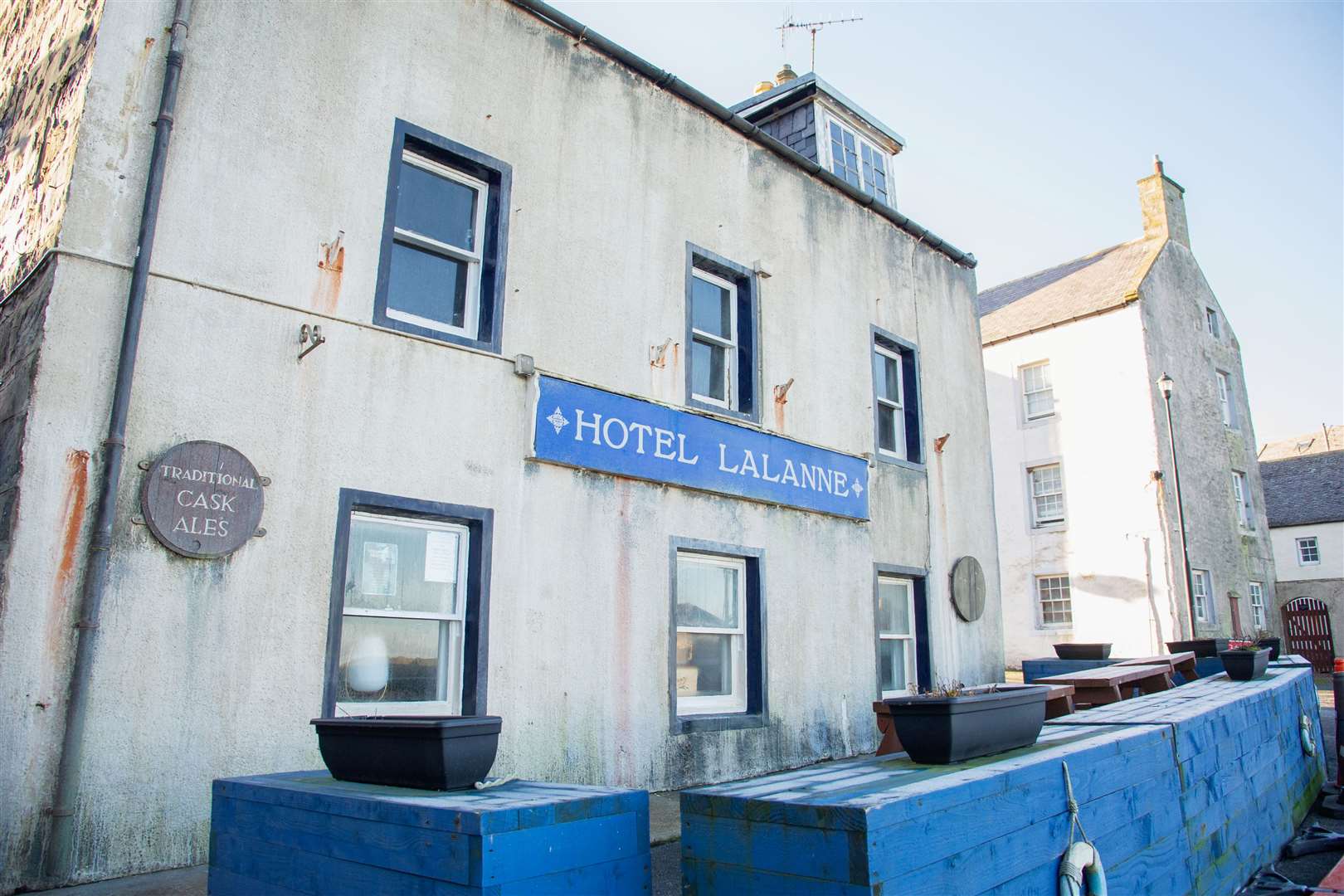 The Shore Inn, in Portsoy, has been temporarily renamed "Hotel Lalanne" for filming and painted in a murky off-white. Picture: Daniel Forsyth.