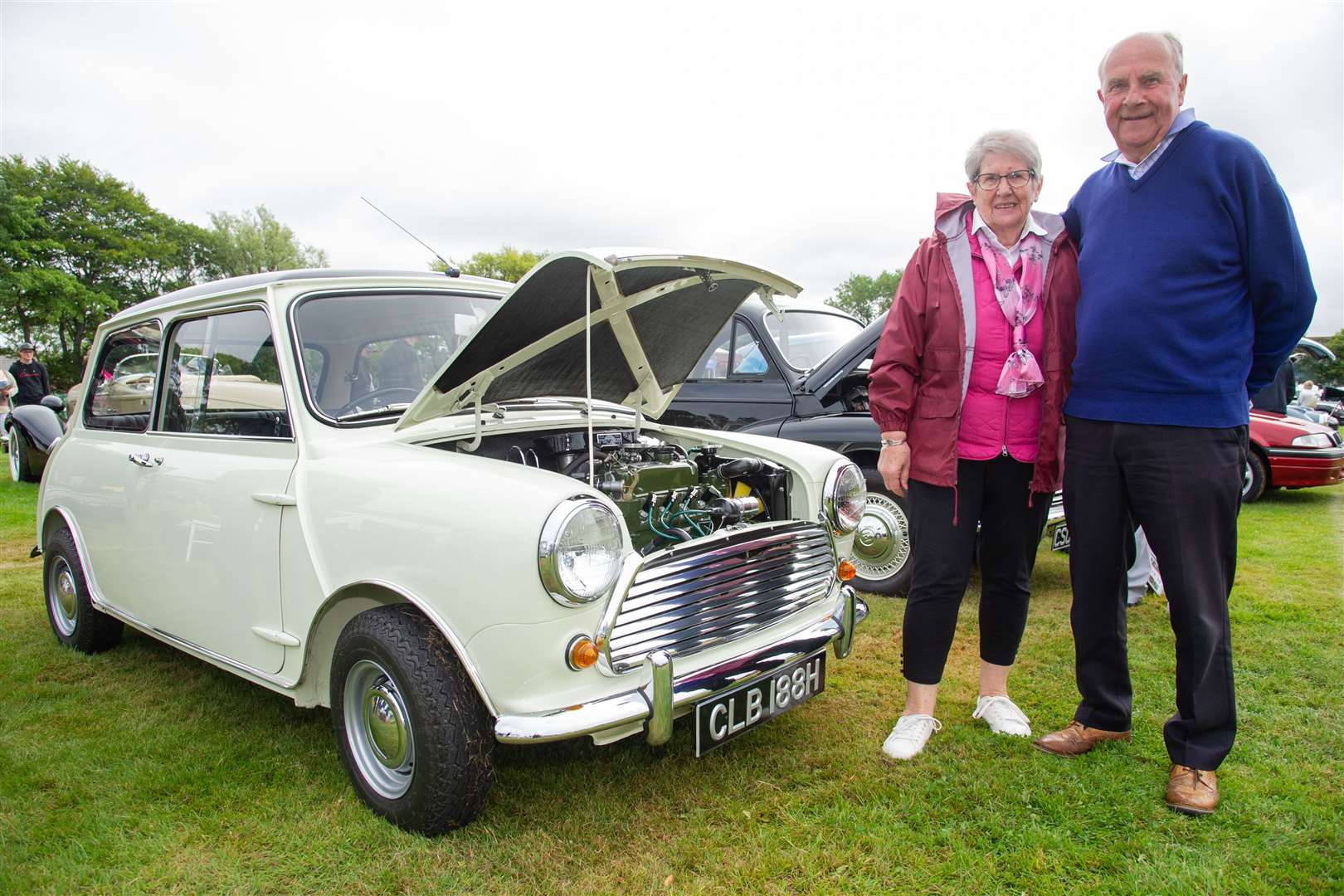 Kathleen and Cyril Craig alongisde their Mini Cooper. ..2021 Buckie Classic Car Show at Linzee Gordon Park, Buckie...Picture: Daniel Forsyth..