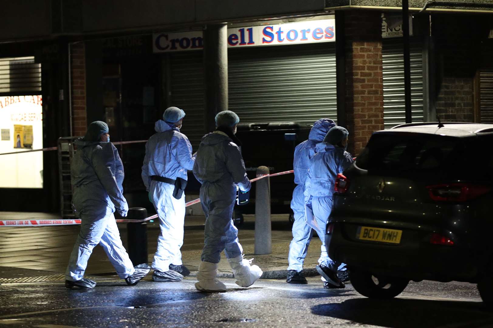 Forensic investigators at the scene in Woodman Parade, Newham (Yui Mok/PA)