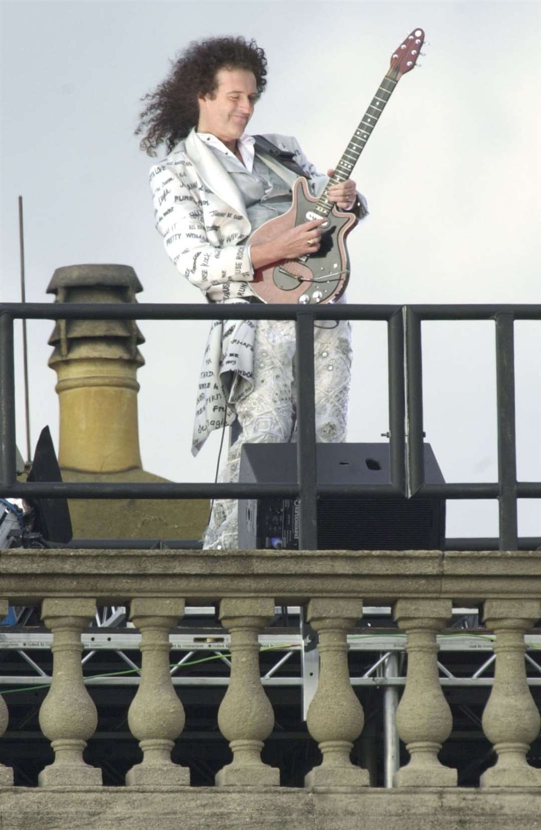 Brian May plays the national anthem from the roof of Buckingham Palace (Stefan Rousseau/PA)