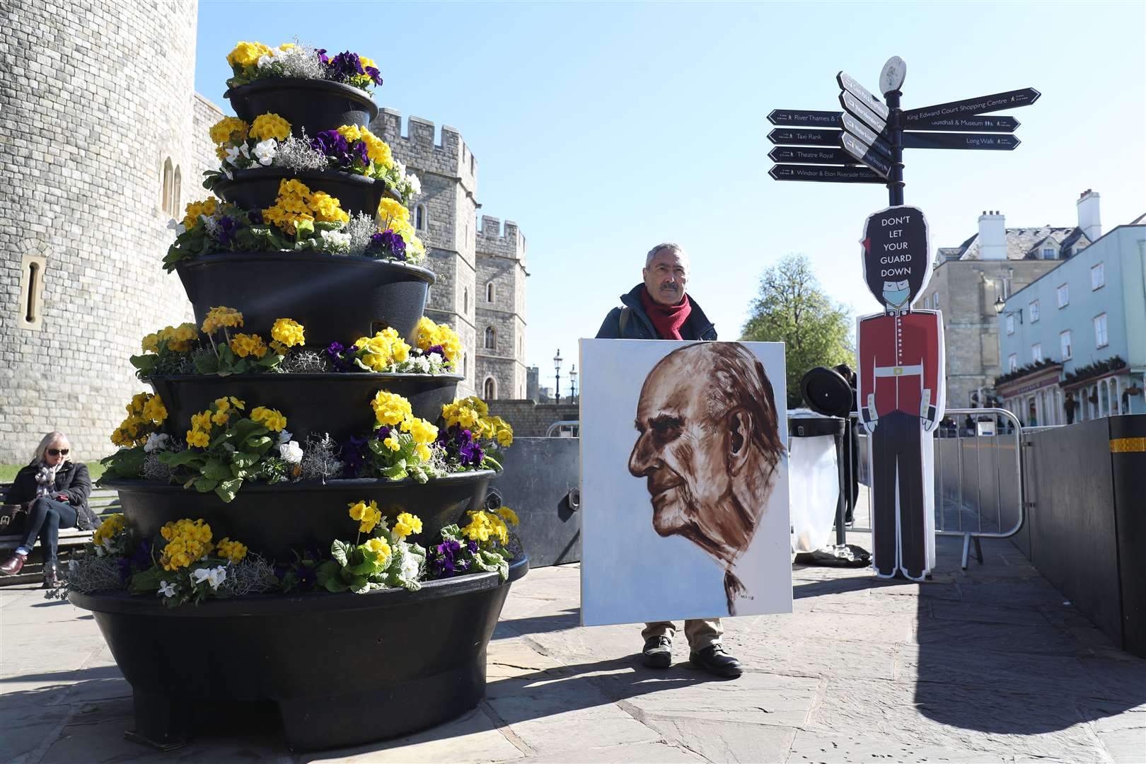 Artist Kaya Mar with a portrait of the Duke of Edinburgh outside Windsor Castle (Andrew Matthews/PA)