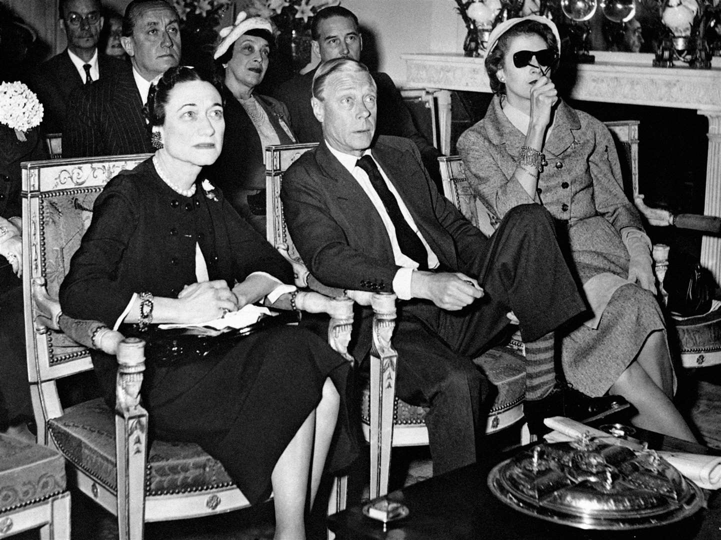 The Duke and Duchess of Windsor watch the coronation of Queen Elizabeth II television screen from Paris in 1953 (PA)