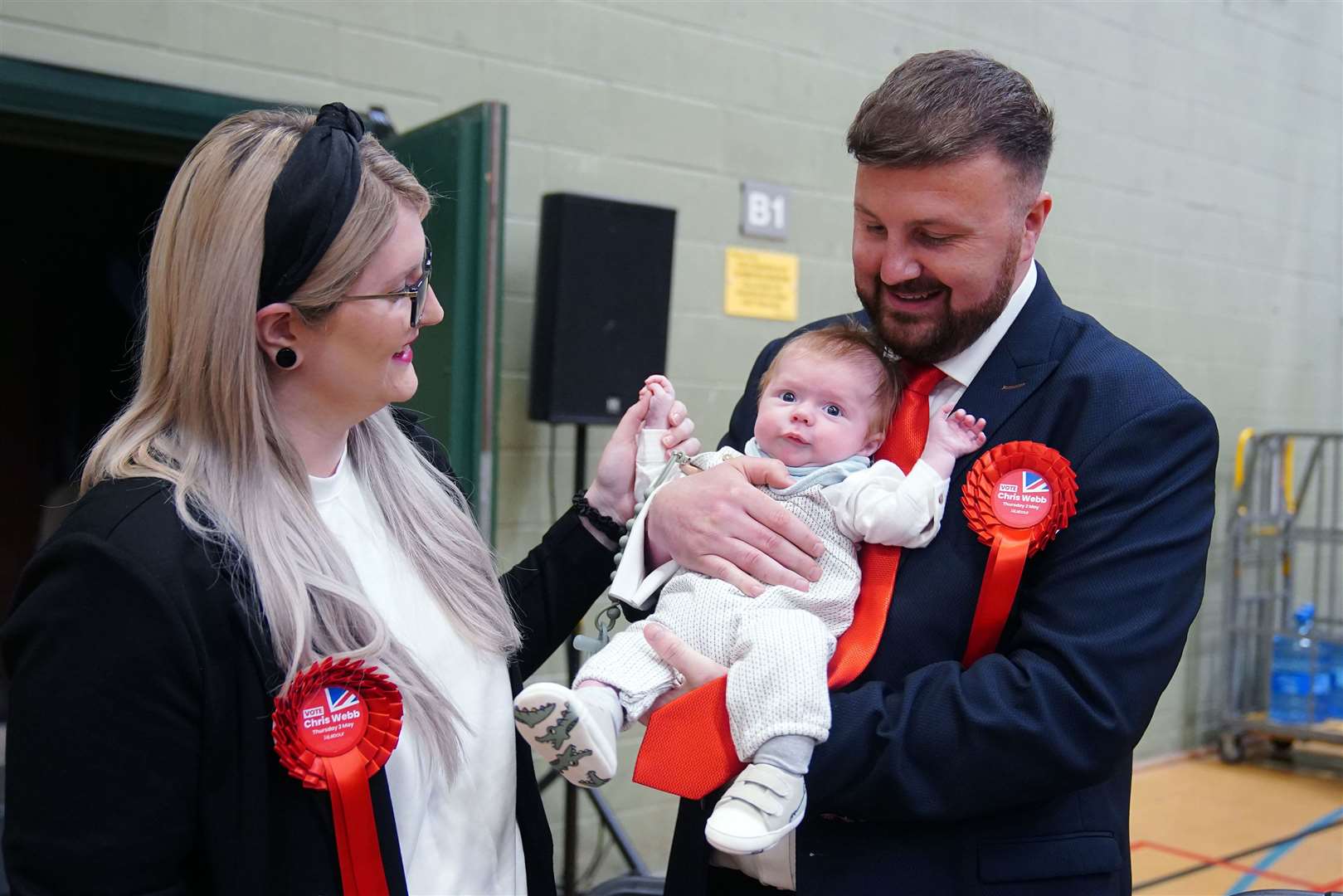Labour candidate Chris Webb celebrates with his wife Portia and baby Cillian Douglas Webb after winning the Blackpool South by-election (Peter Byrne/PA)