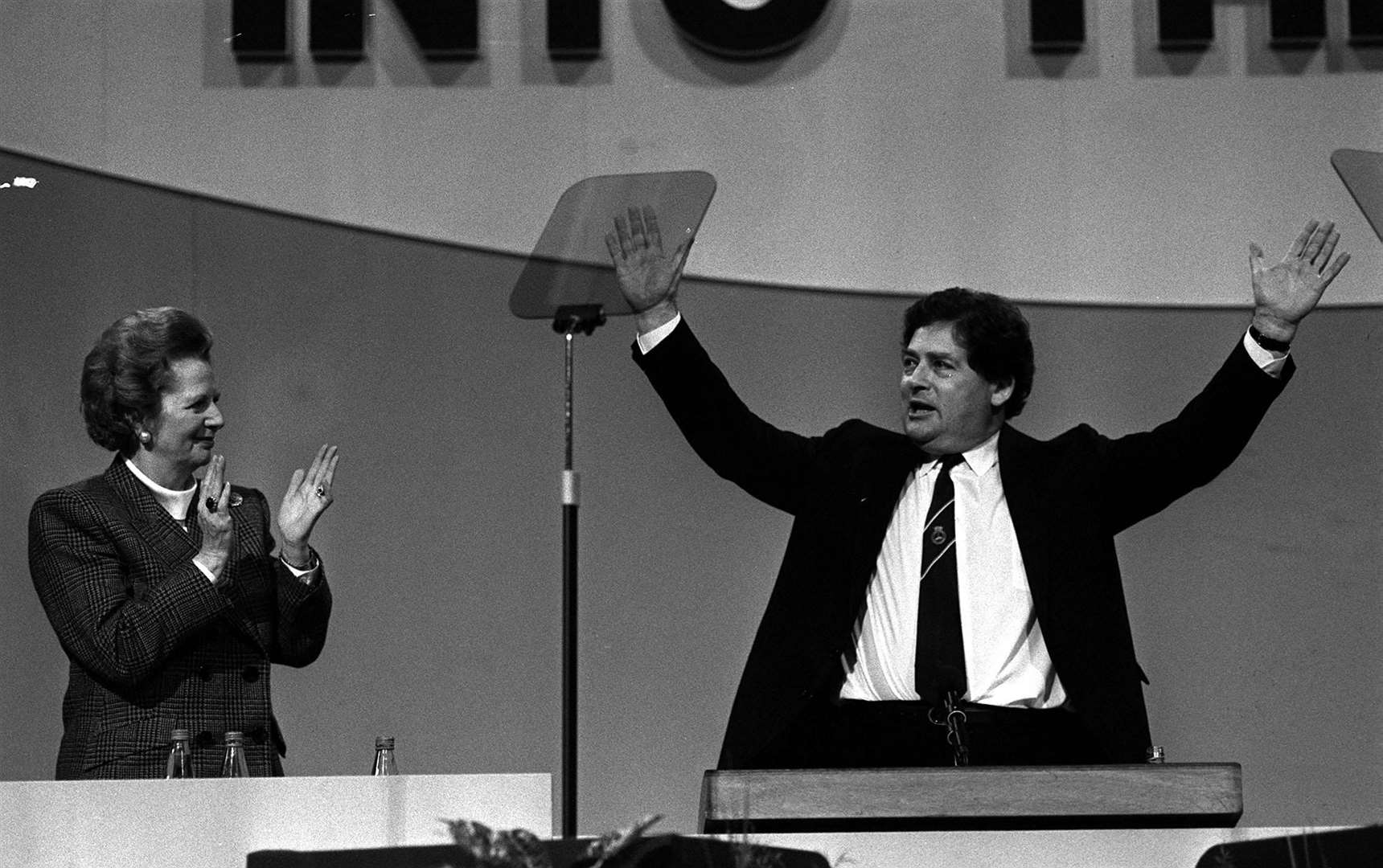 Nigel Lawson applauded by Margaret Thatcher at a Tiory conference (PA)