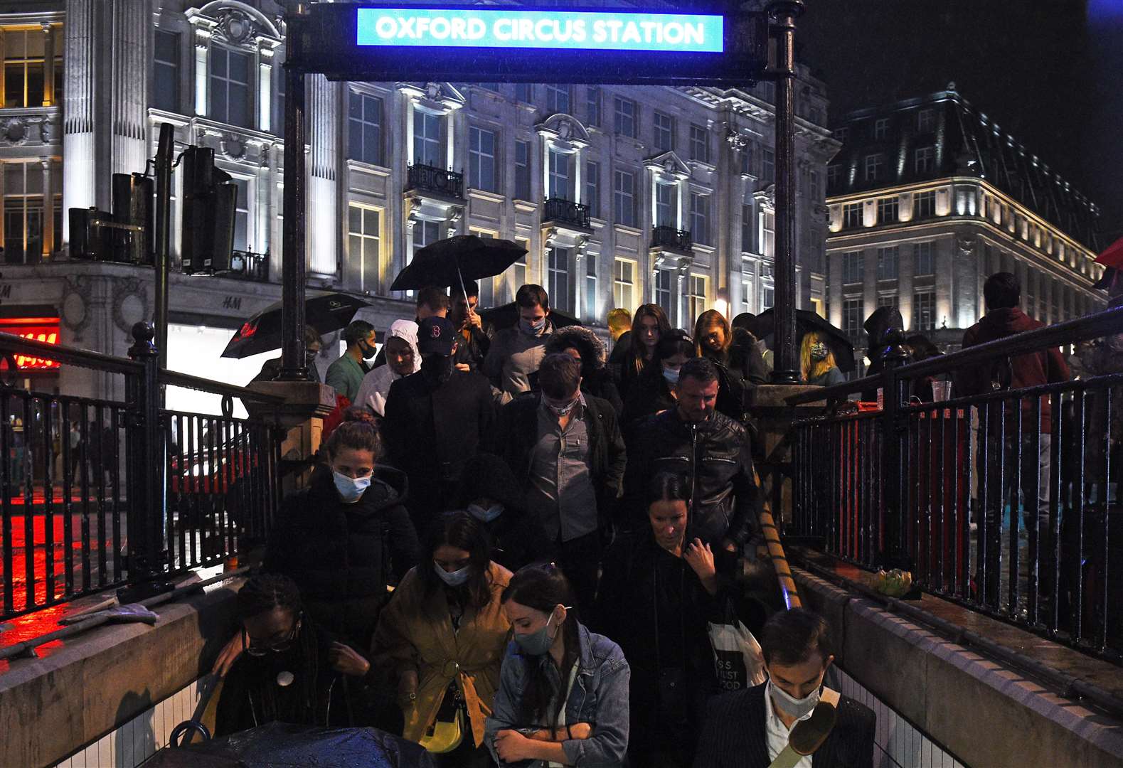 People enter Oxford Circus Underground station in London after the 10pm curfew on Friday night (Kirsty O’Connor/PA)