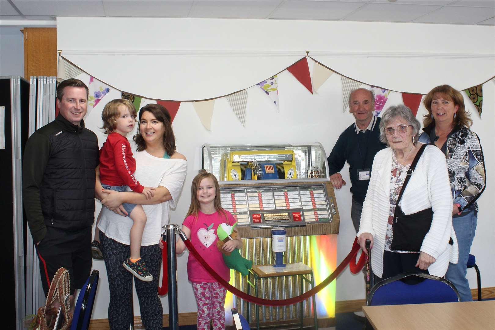 Garioch Heritage society member John Jessiman (third from right) shows off his 'jubilee jukebox ' to visitors to the Heritage centre's family fun and games day, Loco works road, Inverurie on Friday. Picture: Griselda McGregor