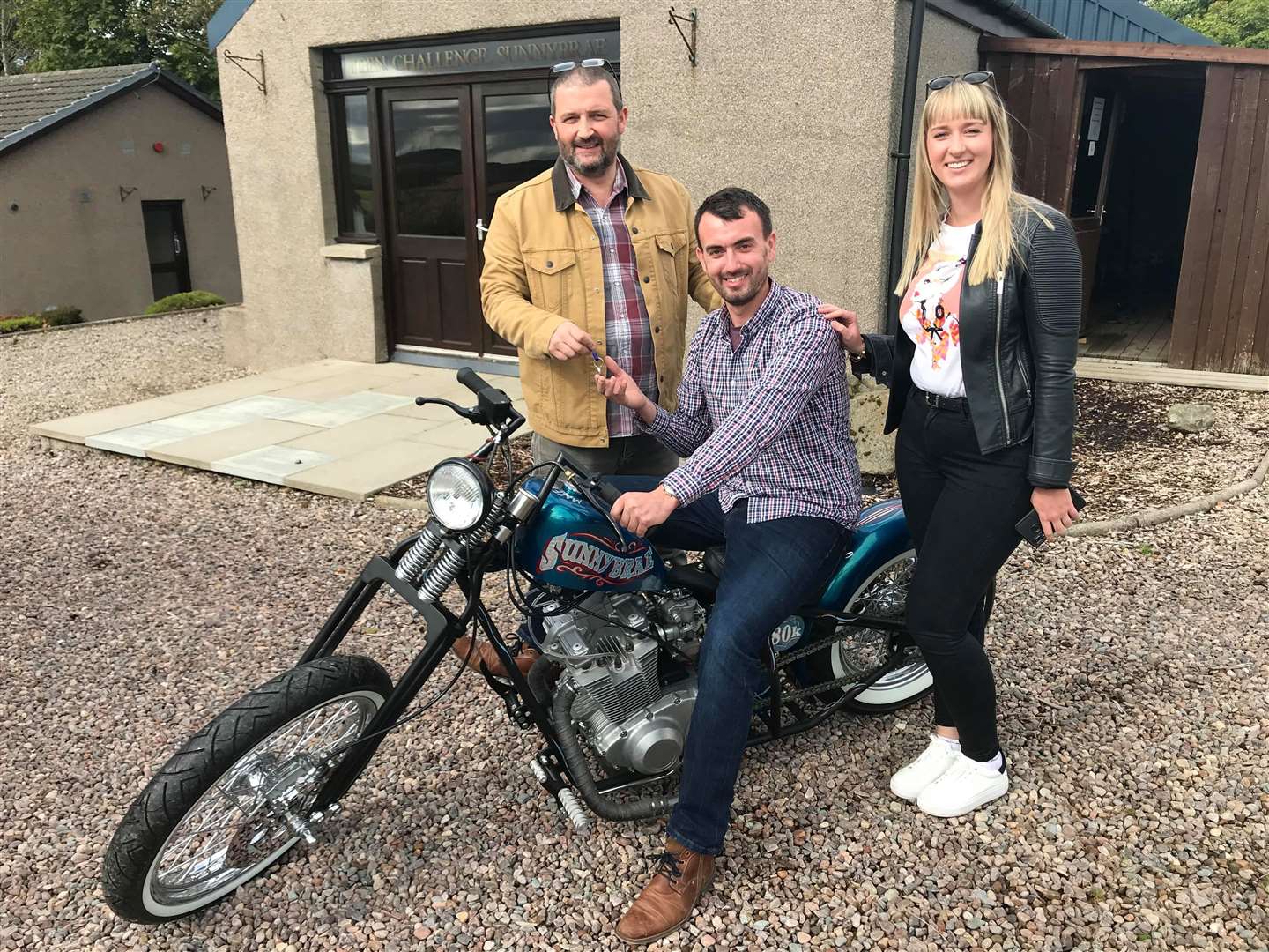 Teen Challenge's Gordon Cruden welcomed winner Matt Wilson and his partner Anna to collect the prize motorcycle.