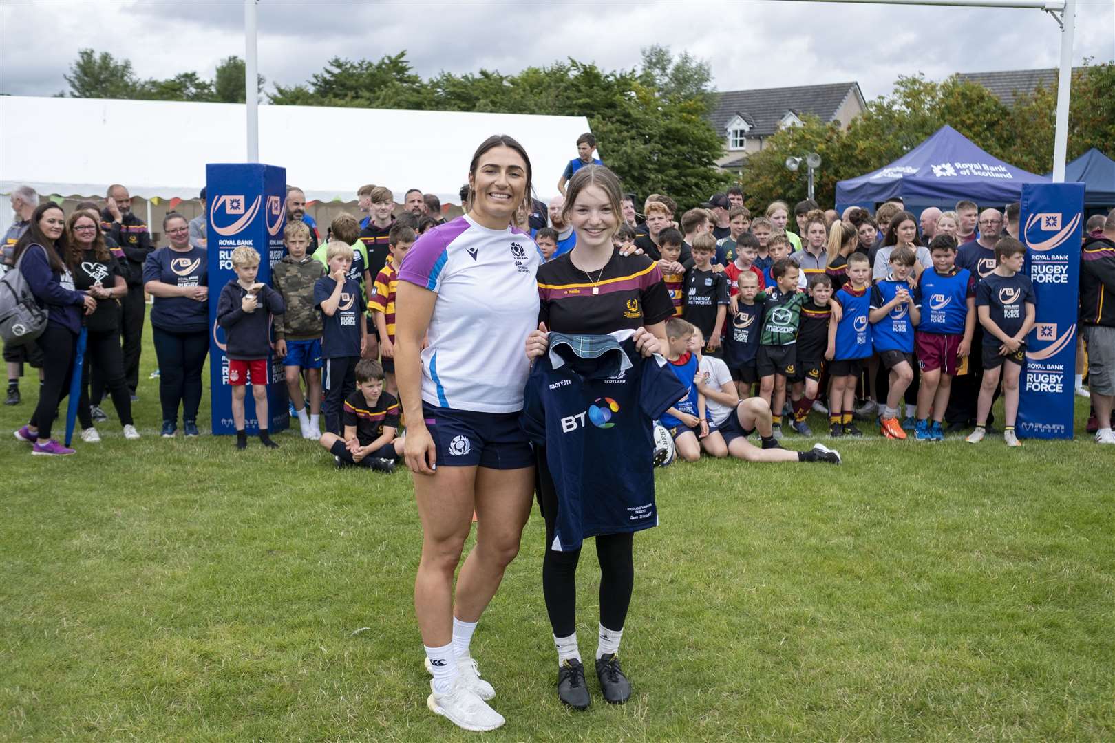 Former Ellon Rugby Club player and Scotland international Emma Wassell returned to her grassroots club to meet members of the current women's teams and presented one of her Scotland shirts to local player Megan Leiper.