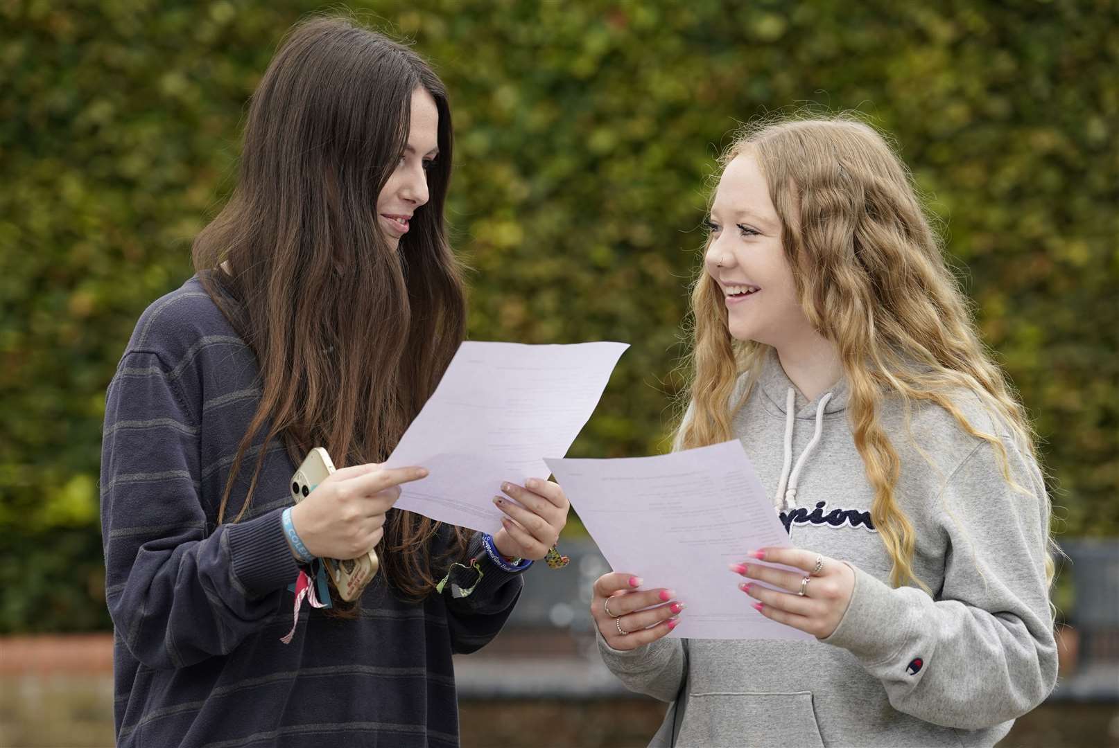 Nikita Howard, left, and Skye Paterson share their results for their T-levels (Andrew Matthews/PA)