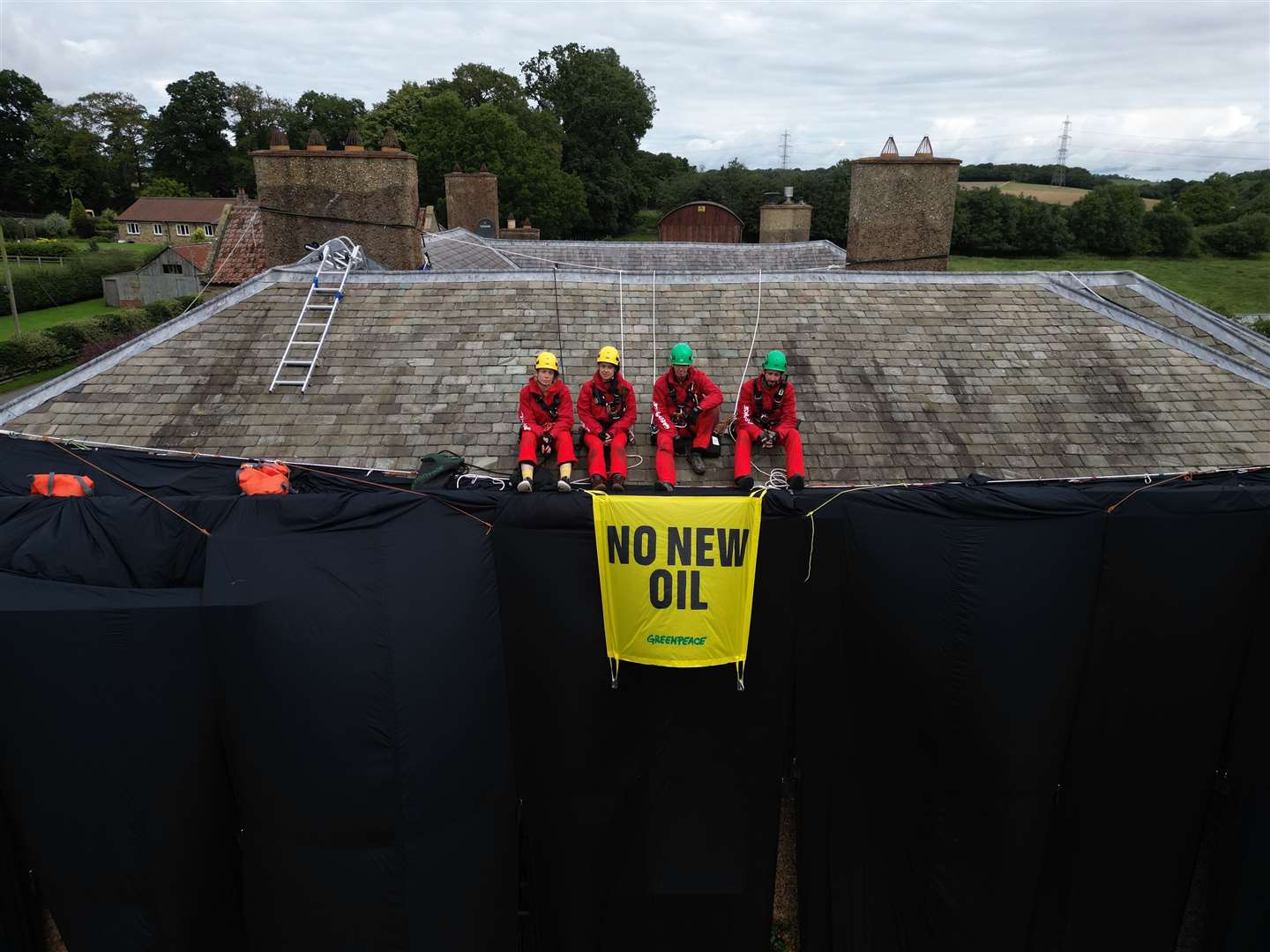 Greenpeace activists on the roof of Prime Minister Rishi Sunak’s house in North Yorkshire (Danny Lawson/PA)